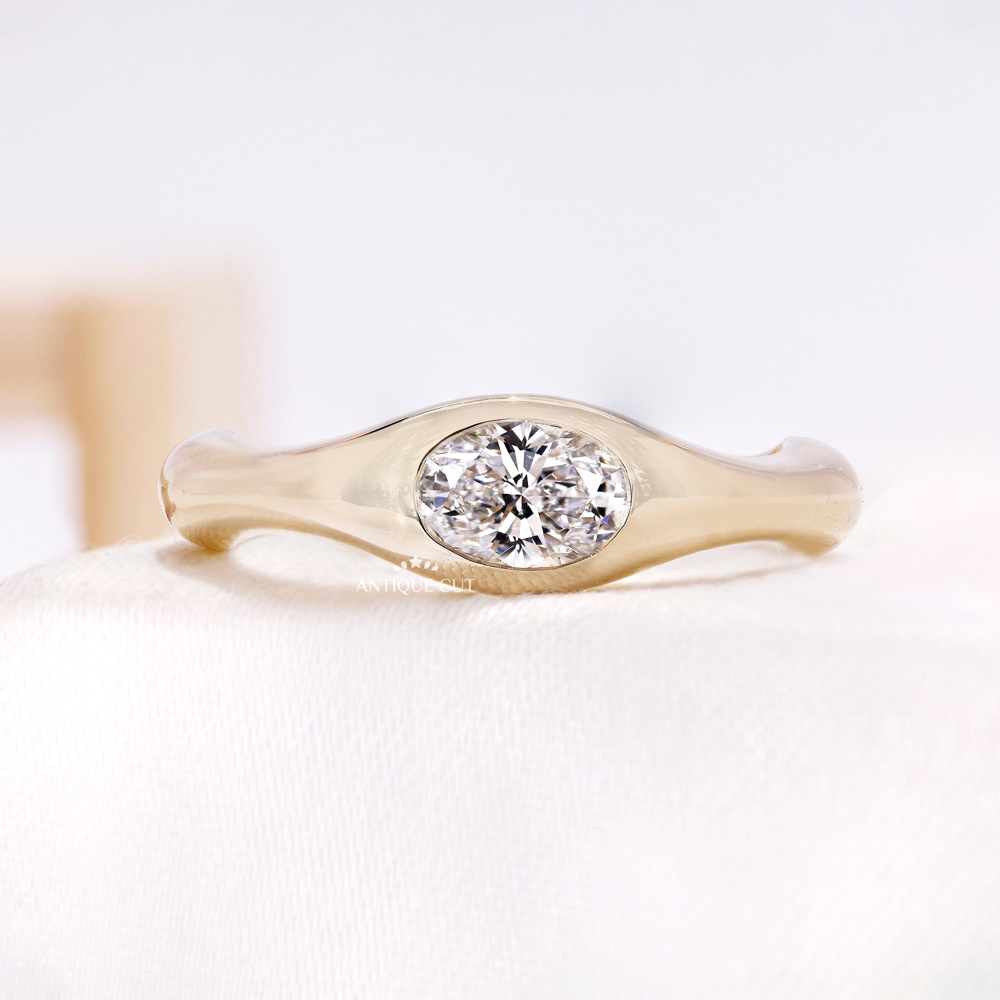 0.50 Carat East West Oval Lab Grown Diamond Bezel Set Engagement Ring