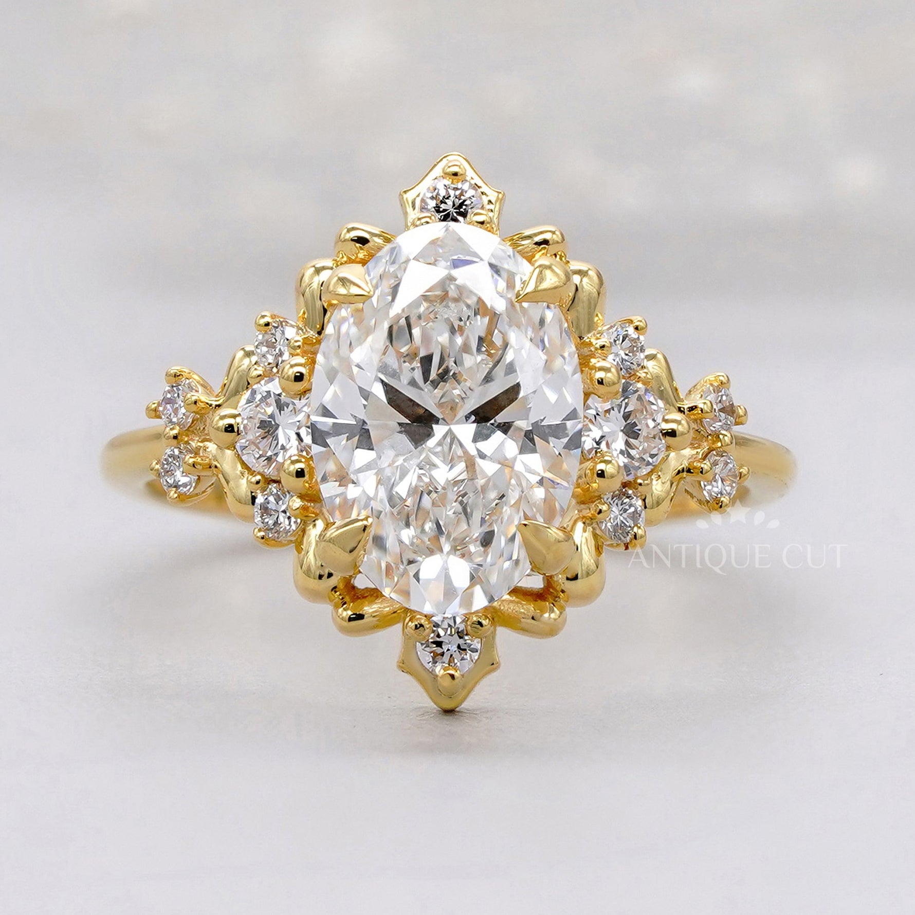 Vintage oval diamond engagement ring with floral halo in yellow gold