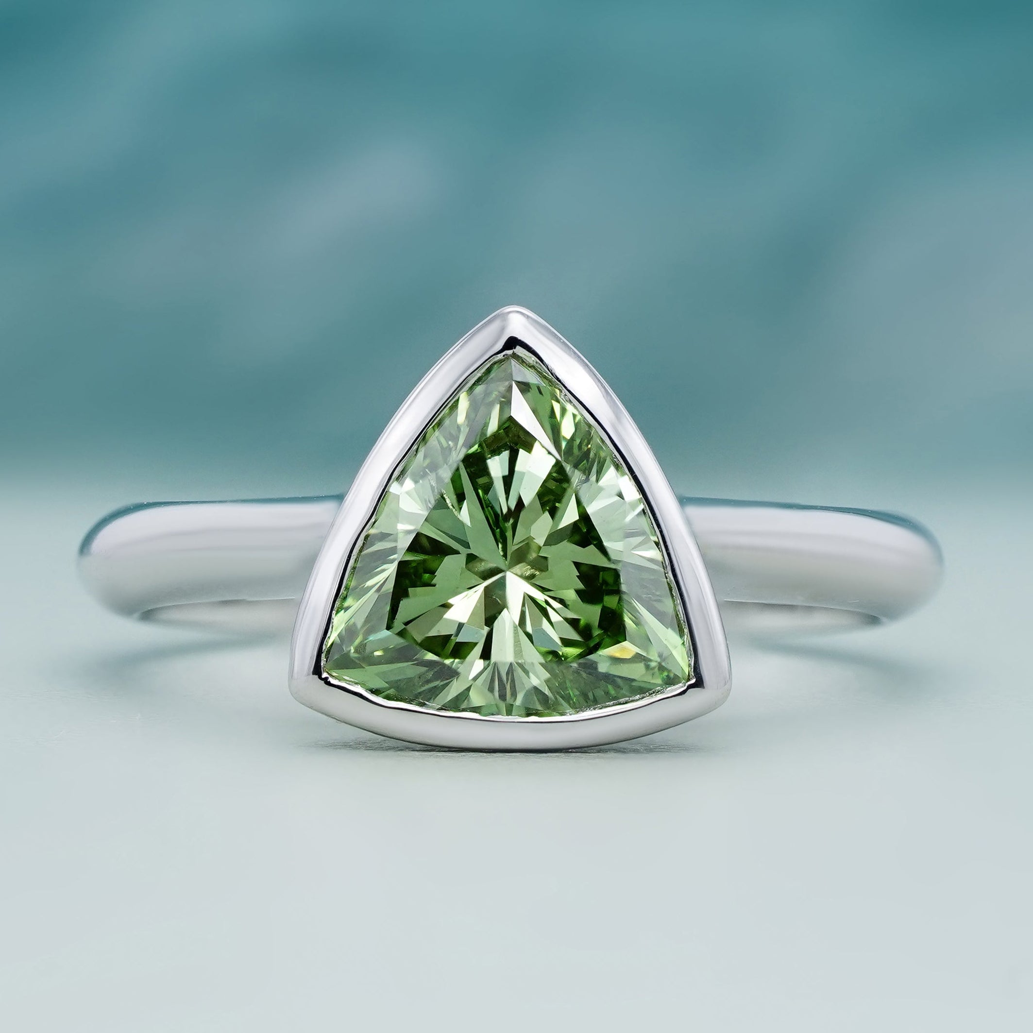 Trillion cut diamond ring fancy green bezel setting white gold