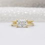 East west radiant cut engagement ring in yellow gold
