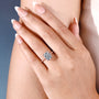 Cushion cut hidden halo engagement ring with solitaire diamond setting
