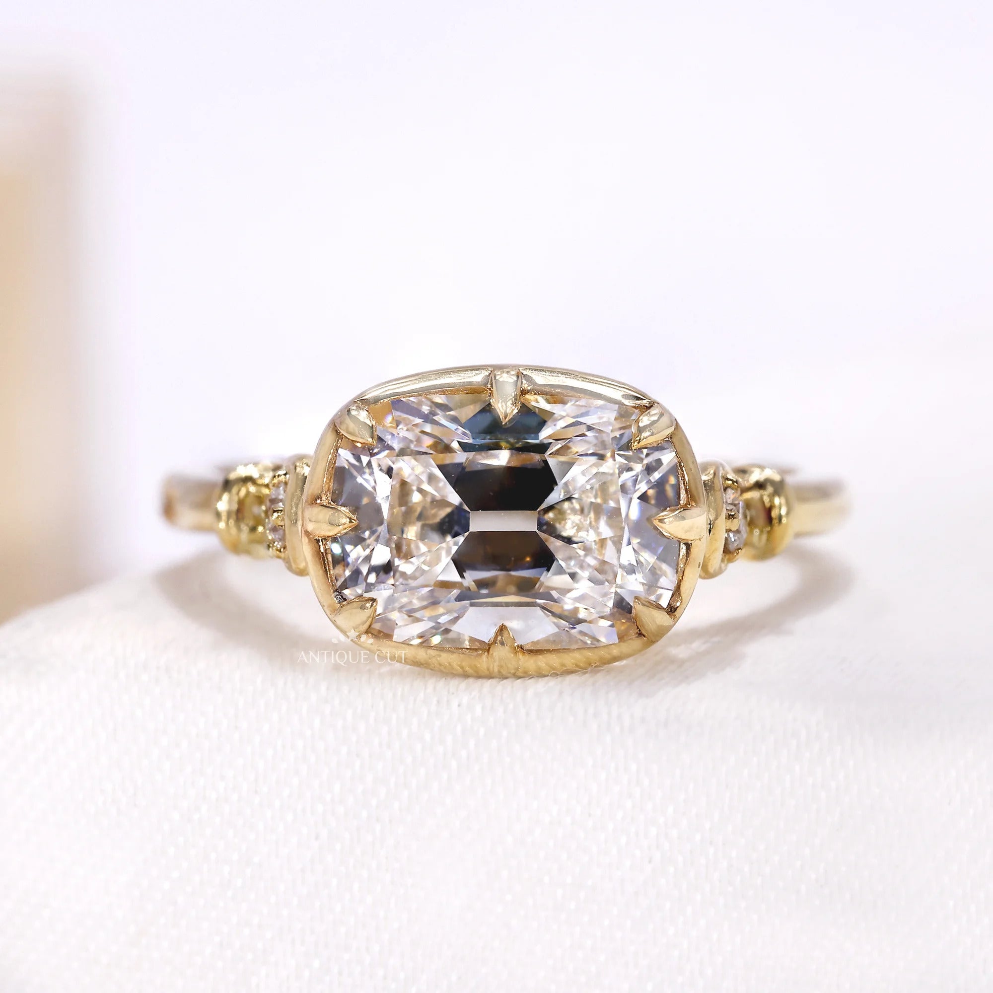 2.50 carat east west old mine cushion diamond engagement ring in yellow gold