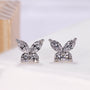 White gold butterfly stud earring with marquise and pear diamonds