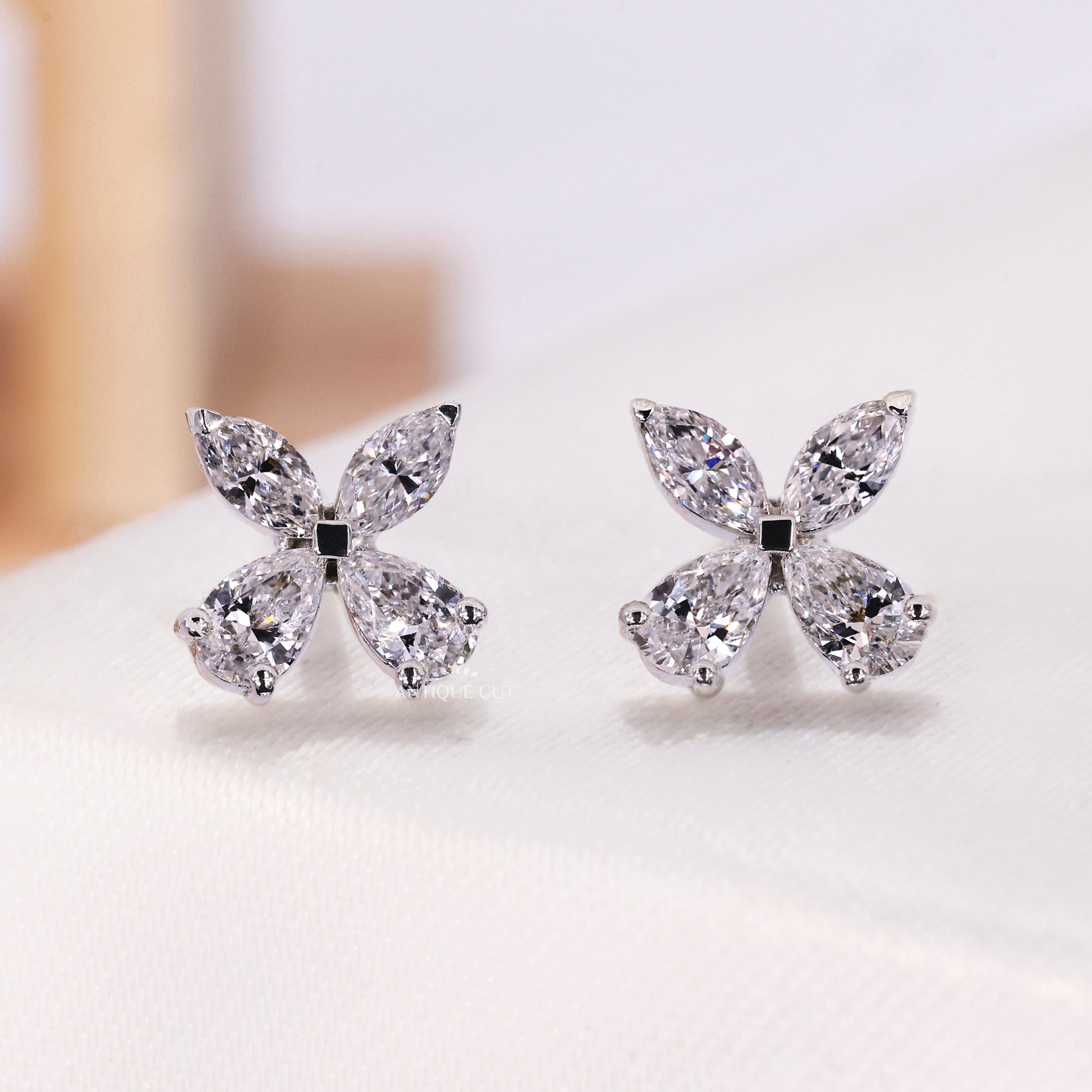 Diamond butterfly stud earrings with marquise and pear cuts