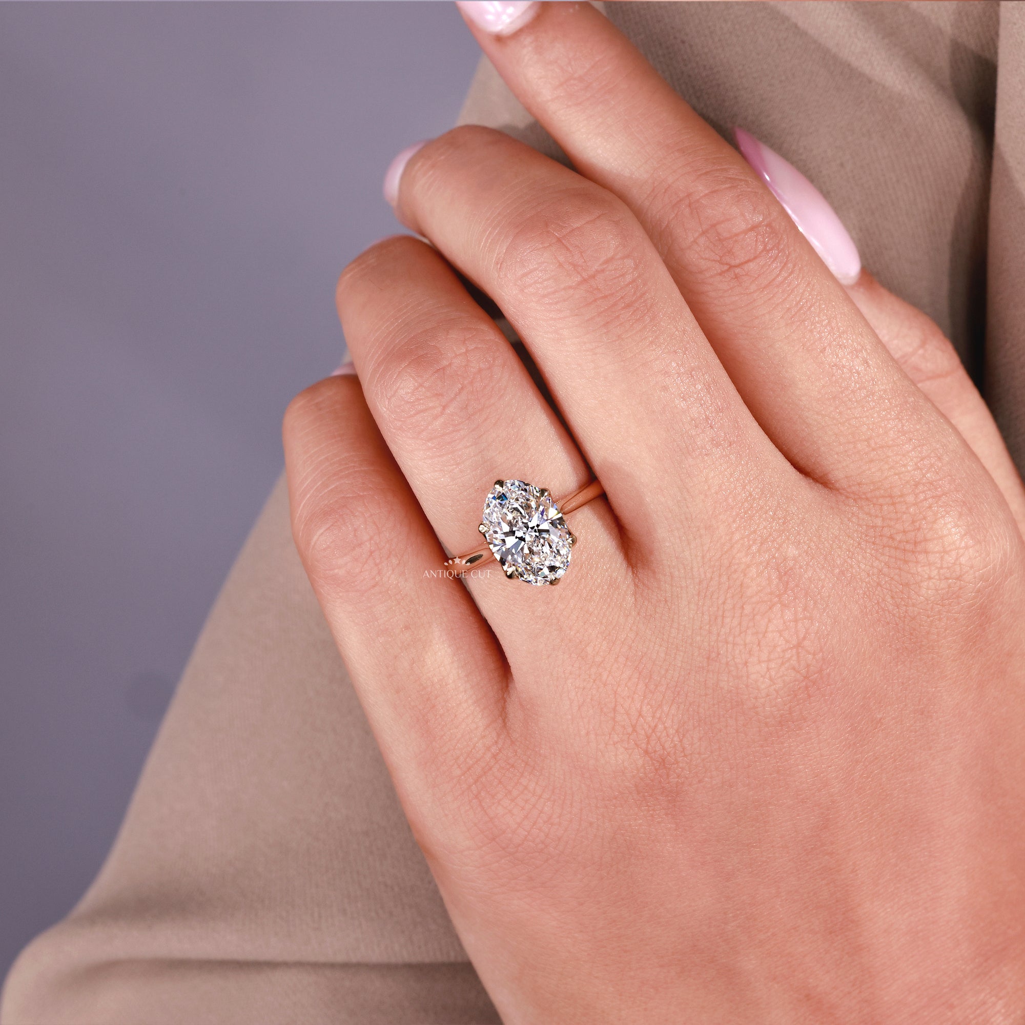 Oval lab grown diamond cathedral engagement ring in yellow gold