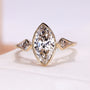 Three Stone Engagement Ring with marquise cut diamond