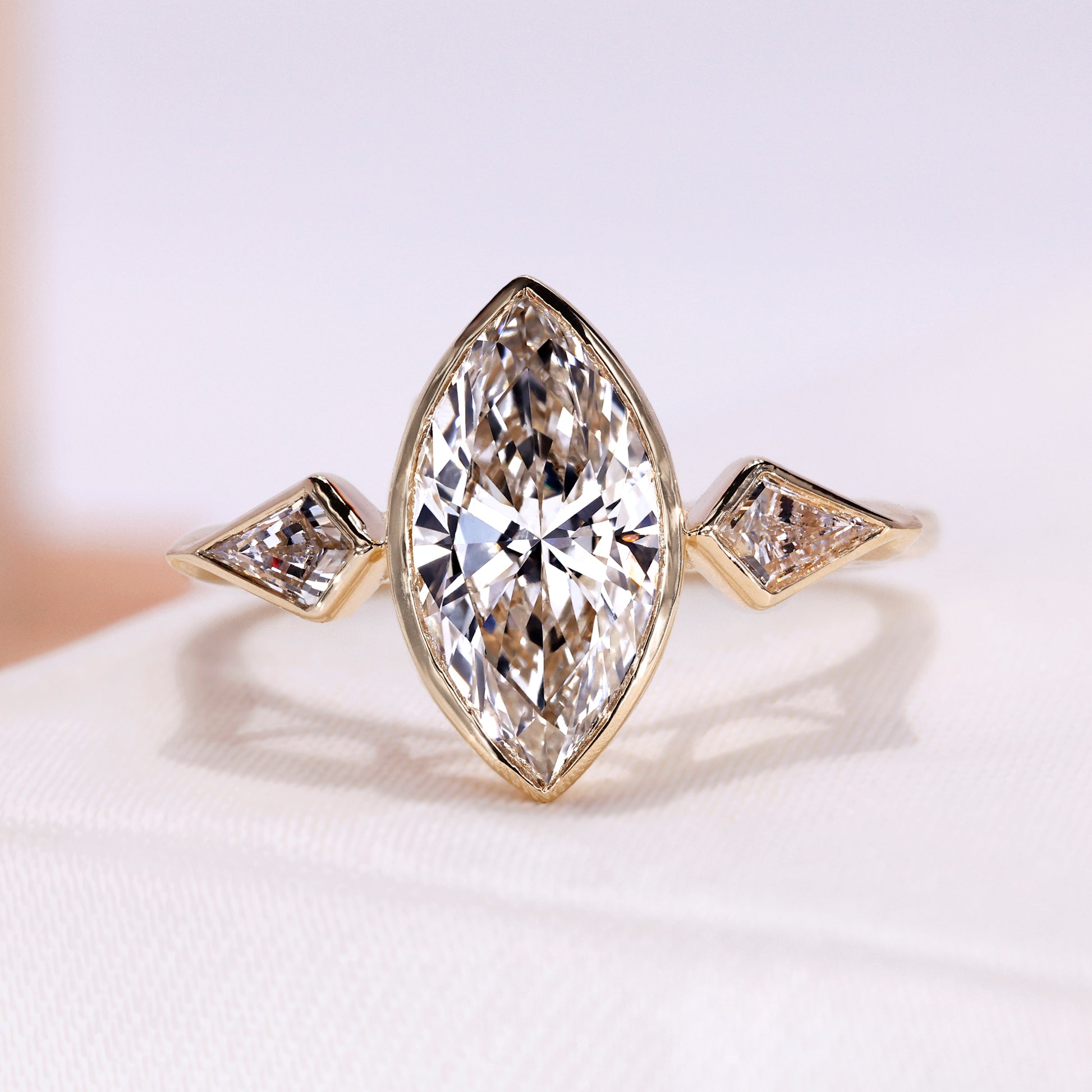 Three Stone Engagement Ring with marquise cut diamond