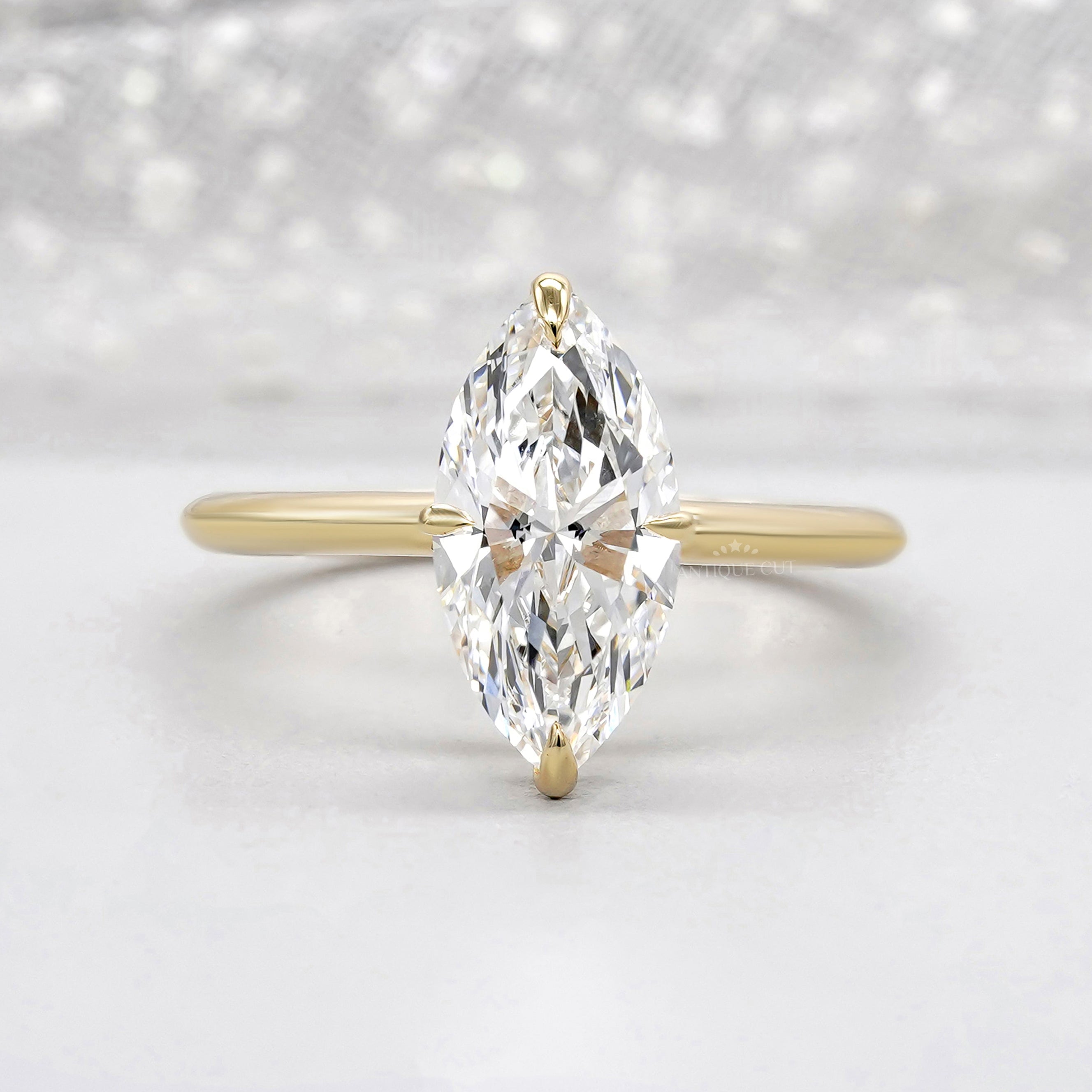 Hidden halo marquise engagement ring in yellow gold