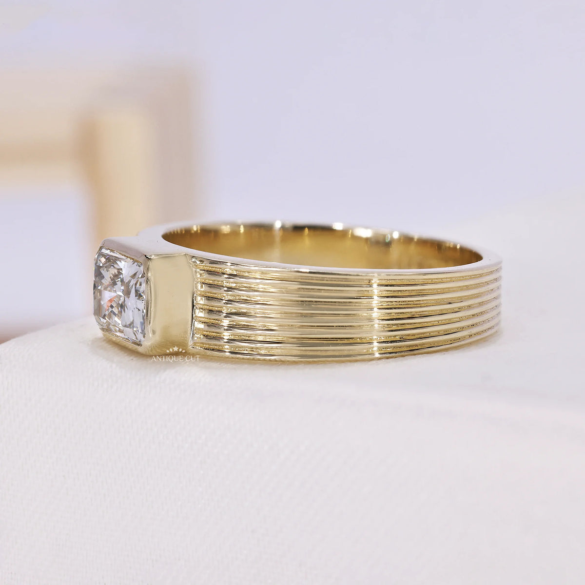 IGI certified emerald cut diamond engagement ring in yellow gold