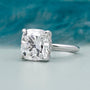 White gold cushion cut engagement ring with subtle hidden halo