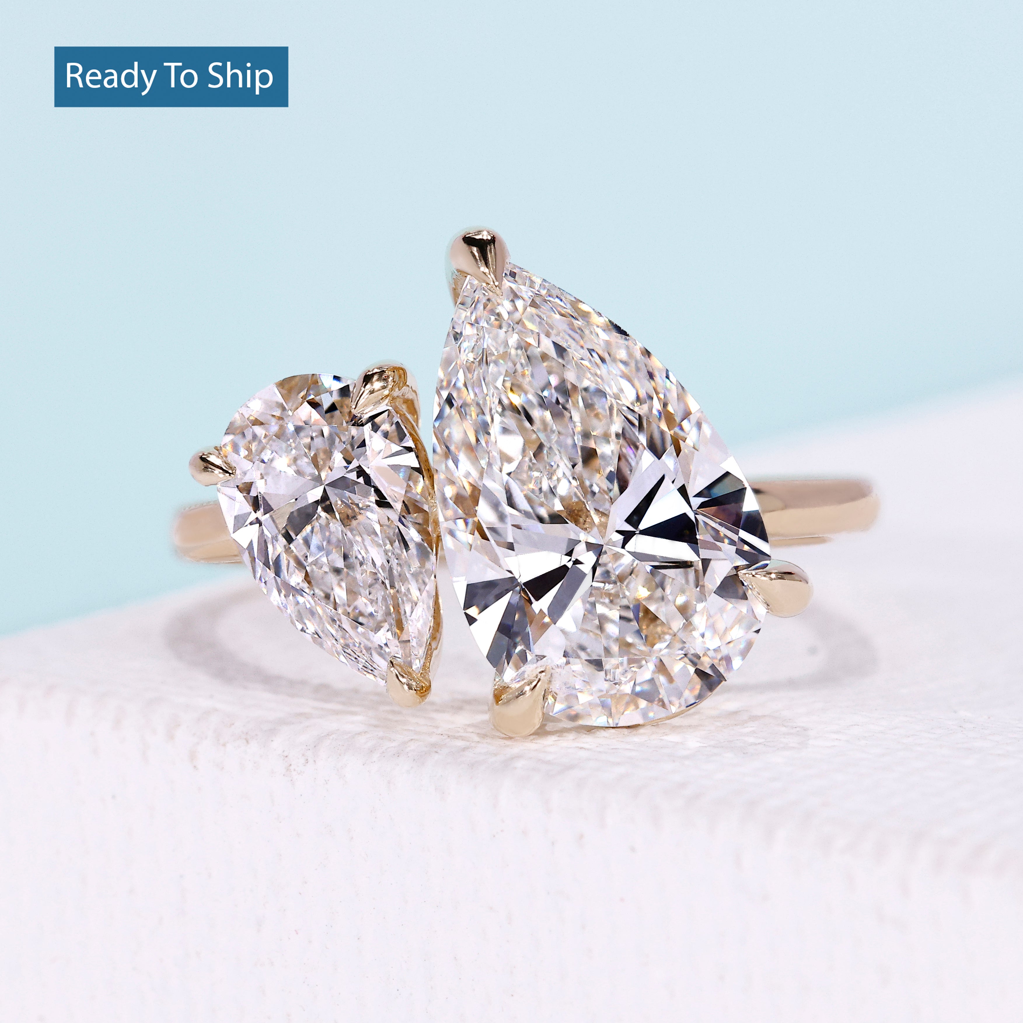 Pear toi et moi ring with pear shaped diamonds in yellow gold setting
