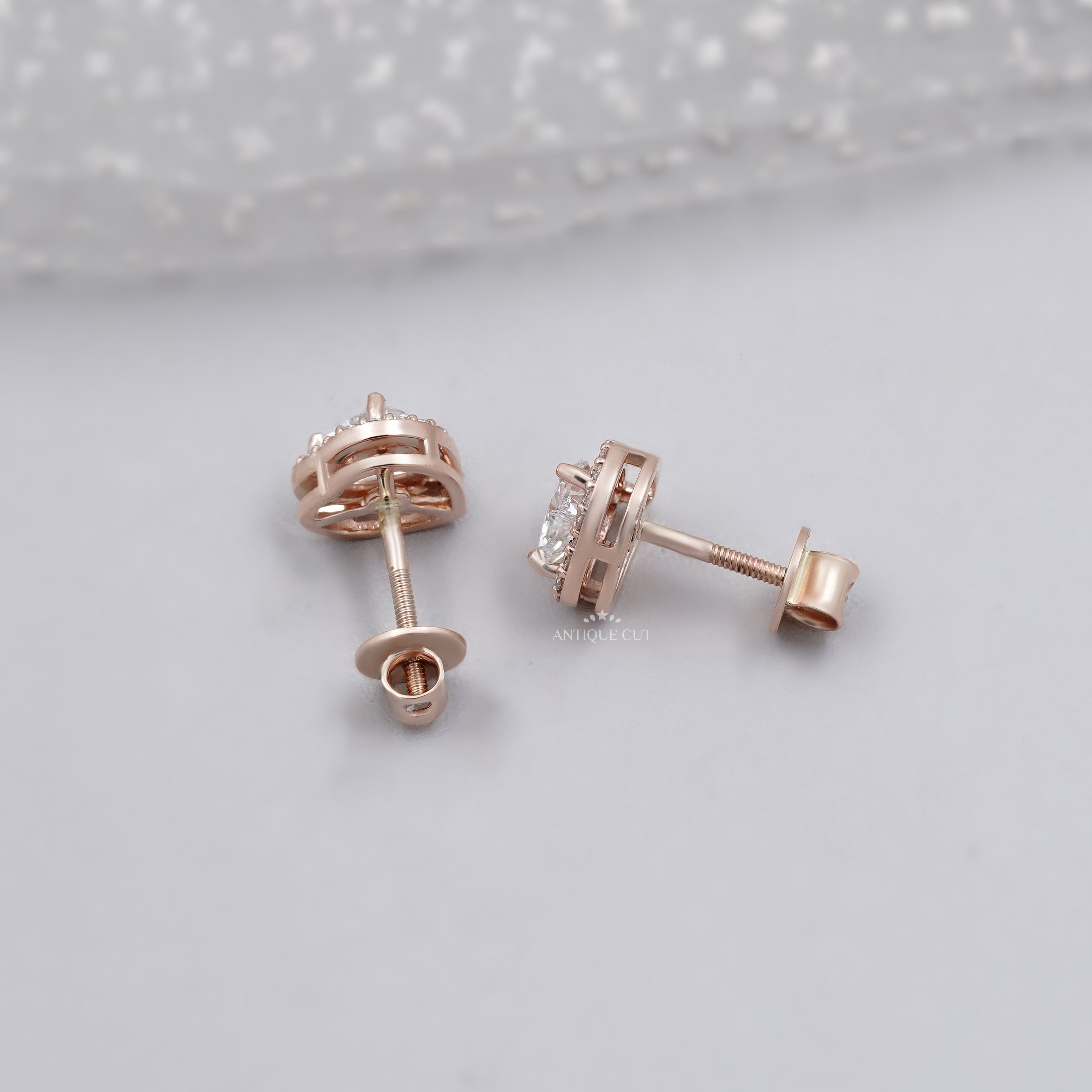Rose gold heart diamond earrings with surrounding halo diamonds