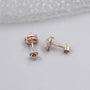 Rose gold heart diamond earrings with surrounding halo diamonds