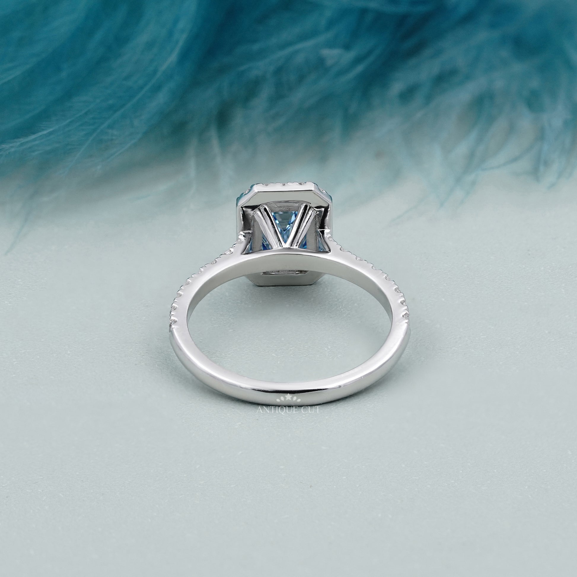 Antique cut fancy blue diamond engagement ring emerald halo
