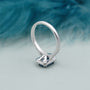 Emerald halo fancy blue diamond ring with pave band
