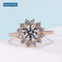 Floral halo round engagement ring with yellow gold setting
