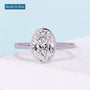 Oval cut engagement ring with bezel setting in white gold
