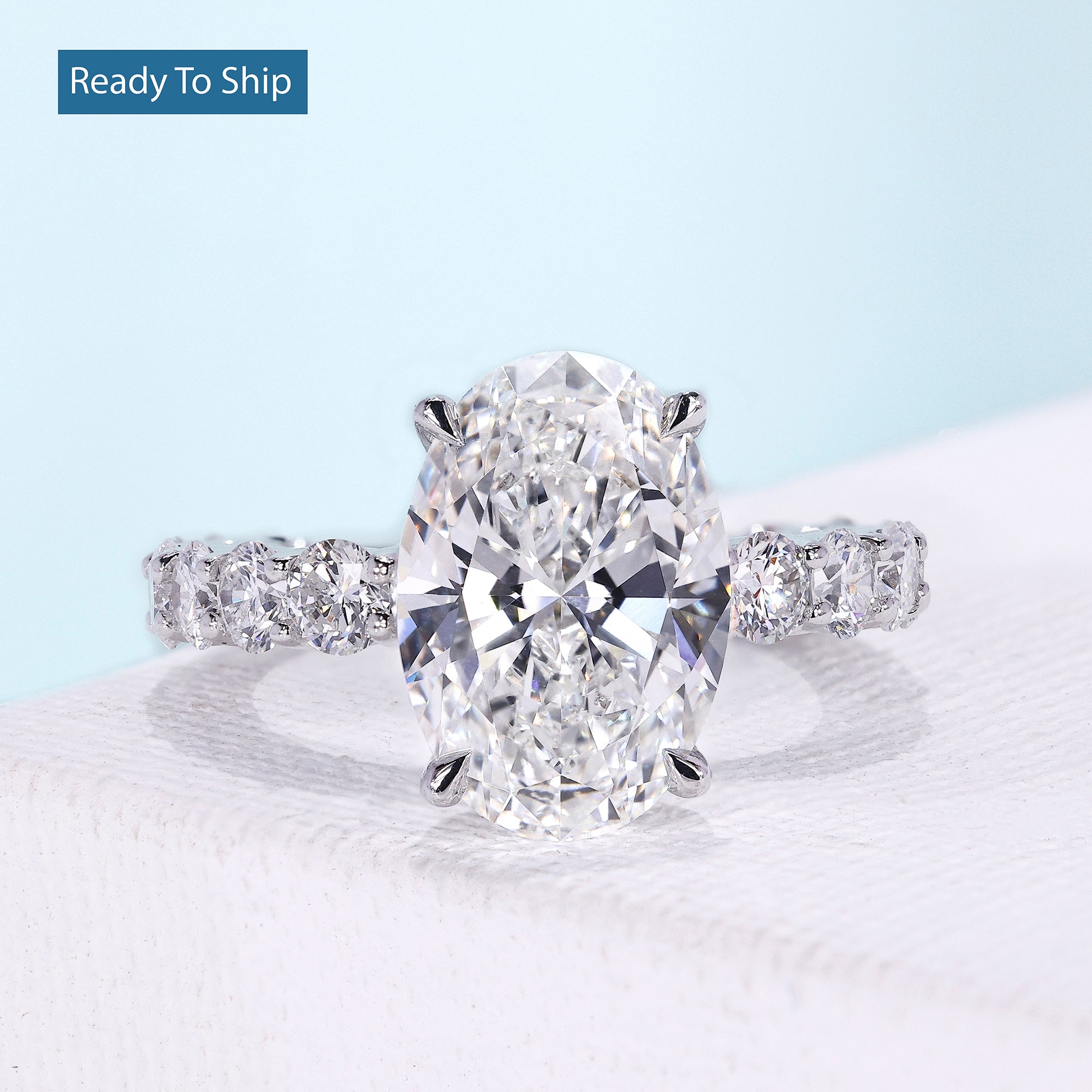 Oval lab grown diamond ring with four claw prongs
