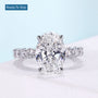 Oval lab grown diamond ring with four claw prongs
