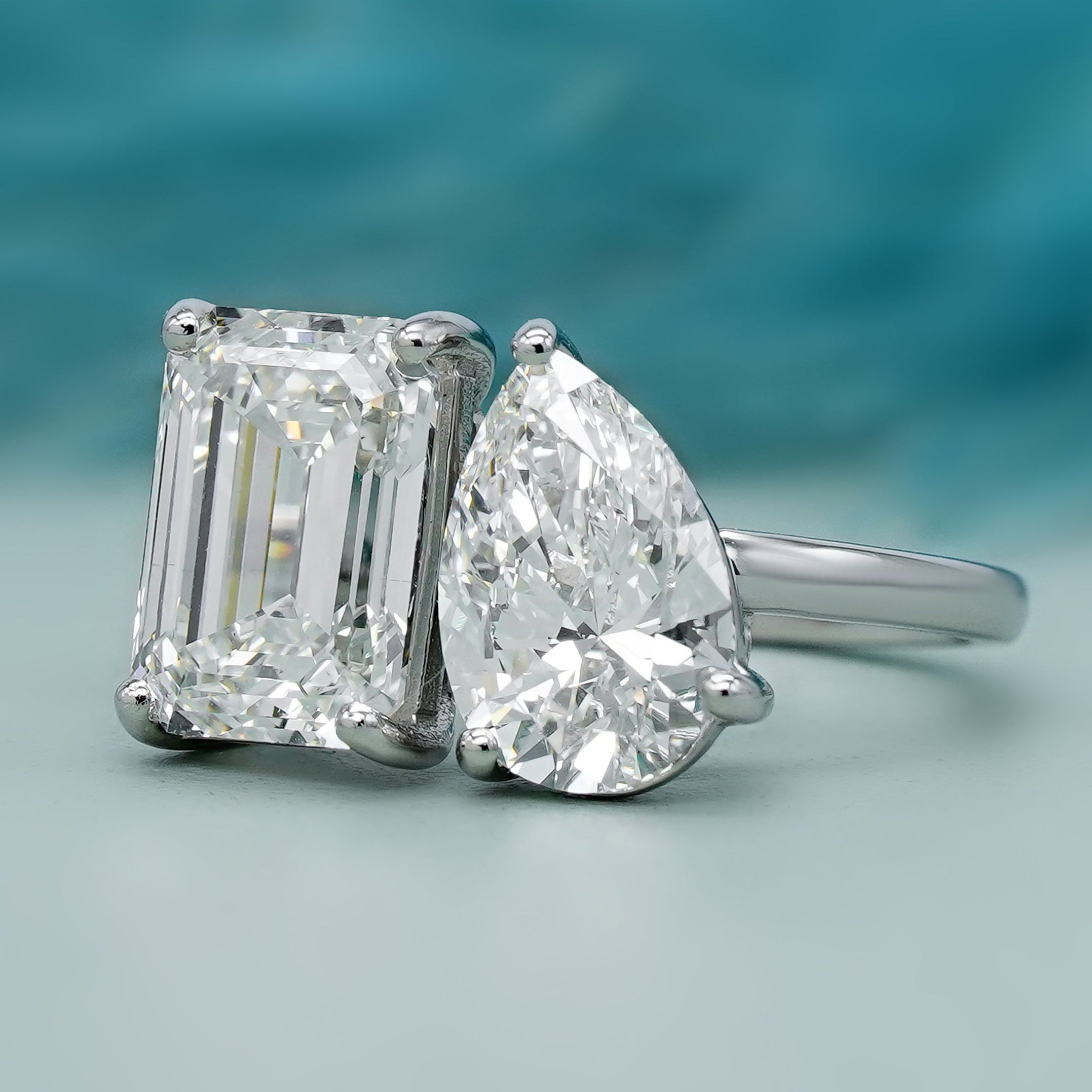 White gold emerald and pear lab grown diamond ring