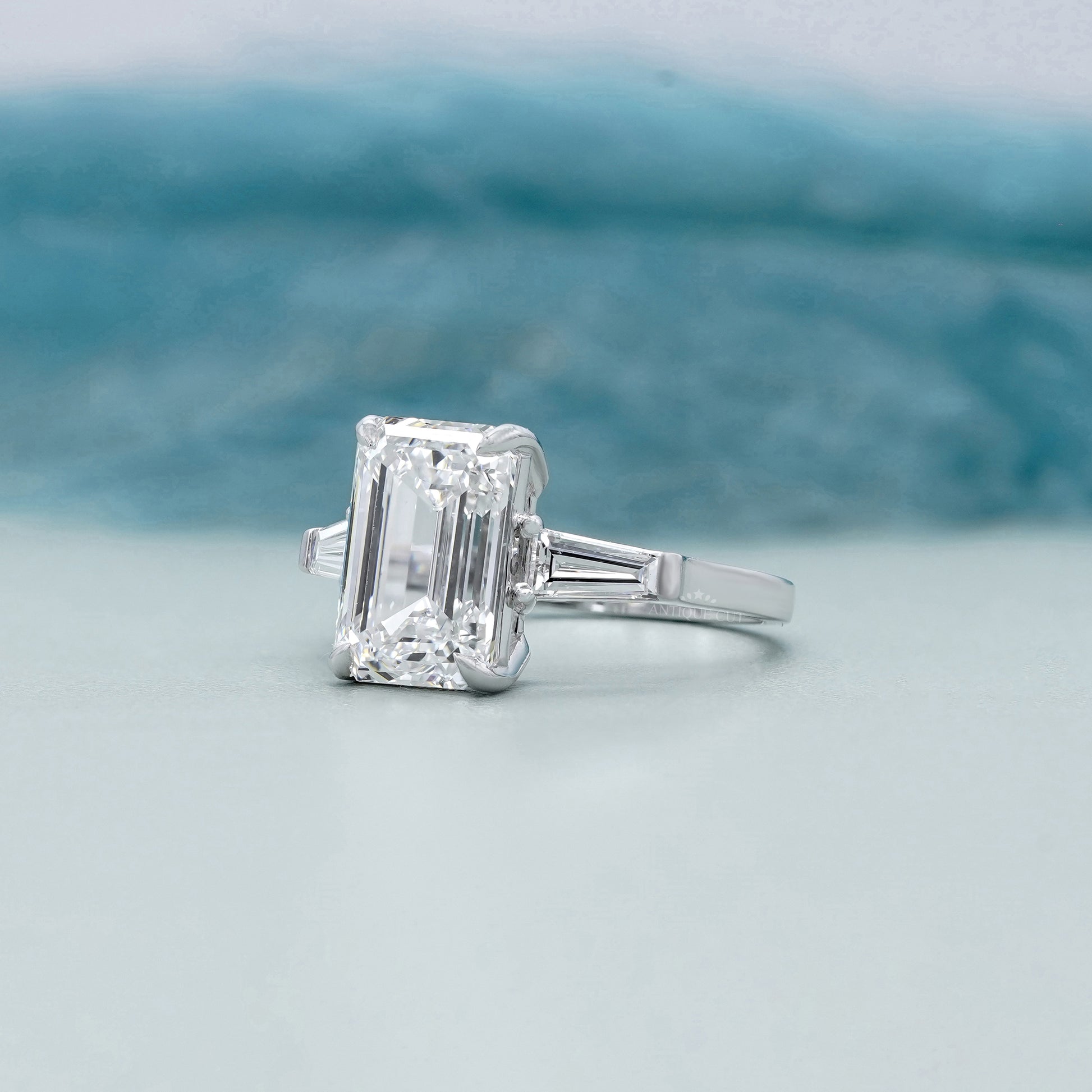 Emerald Cut 5.60tcw Lab Grown Diamond Three Stone Engagement Ring | Baguette Side Stones | Platinum/White Gold | IGI Certified