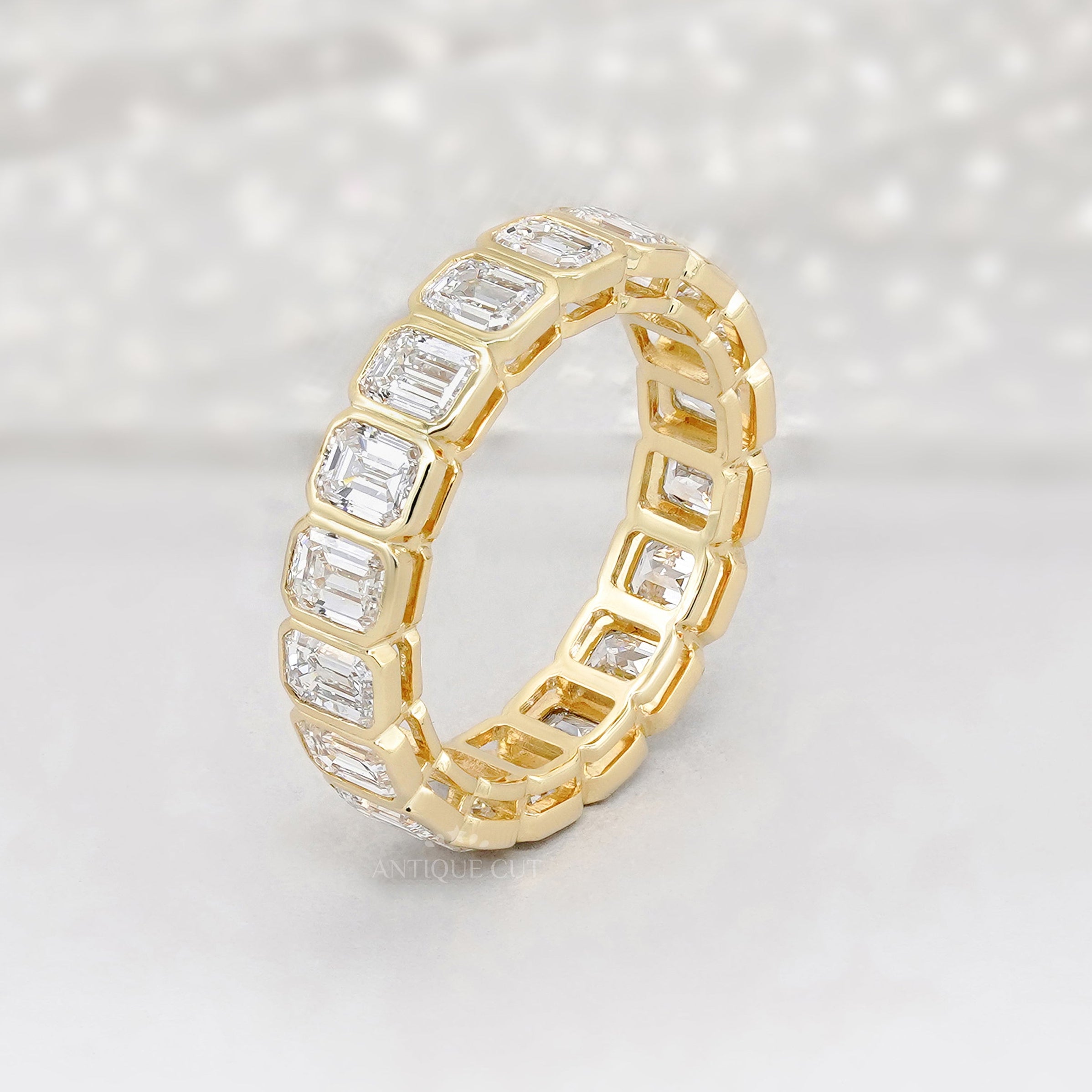 Emerald Cut 3.60tcw Lab Diamond Eternity Band | IGI Certified | Yellow Gold