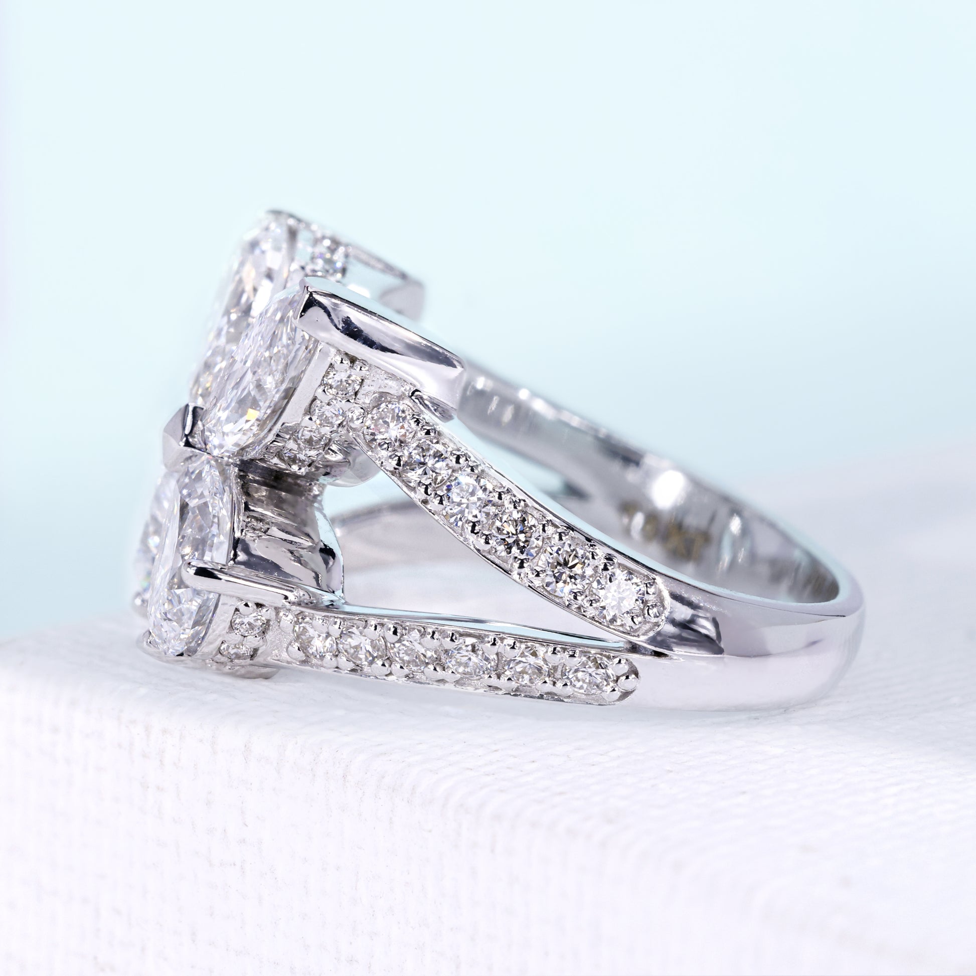 White gold butterfly engagement ring with pave band