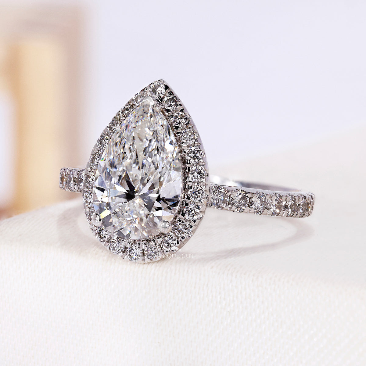 1.50 Carat Pear Shaped Halo Engagement Ring With Pave Band | IGI Certified