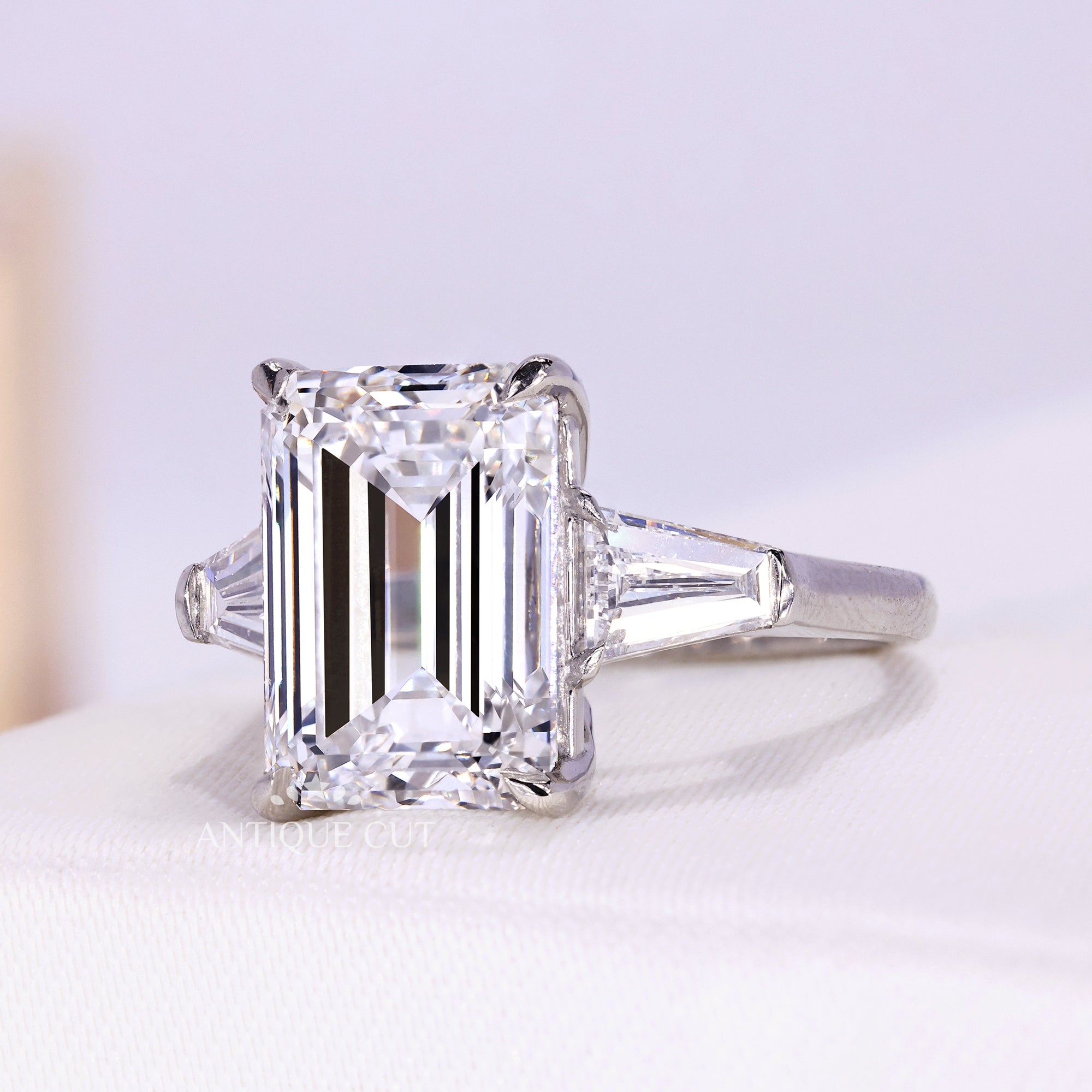 Lab grown emerald diamond ring with tapered baguette side stones