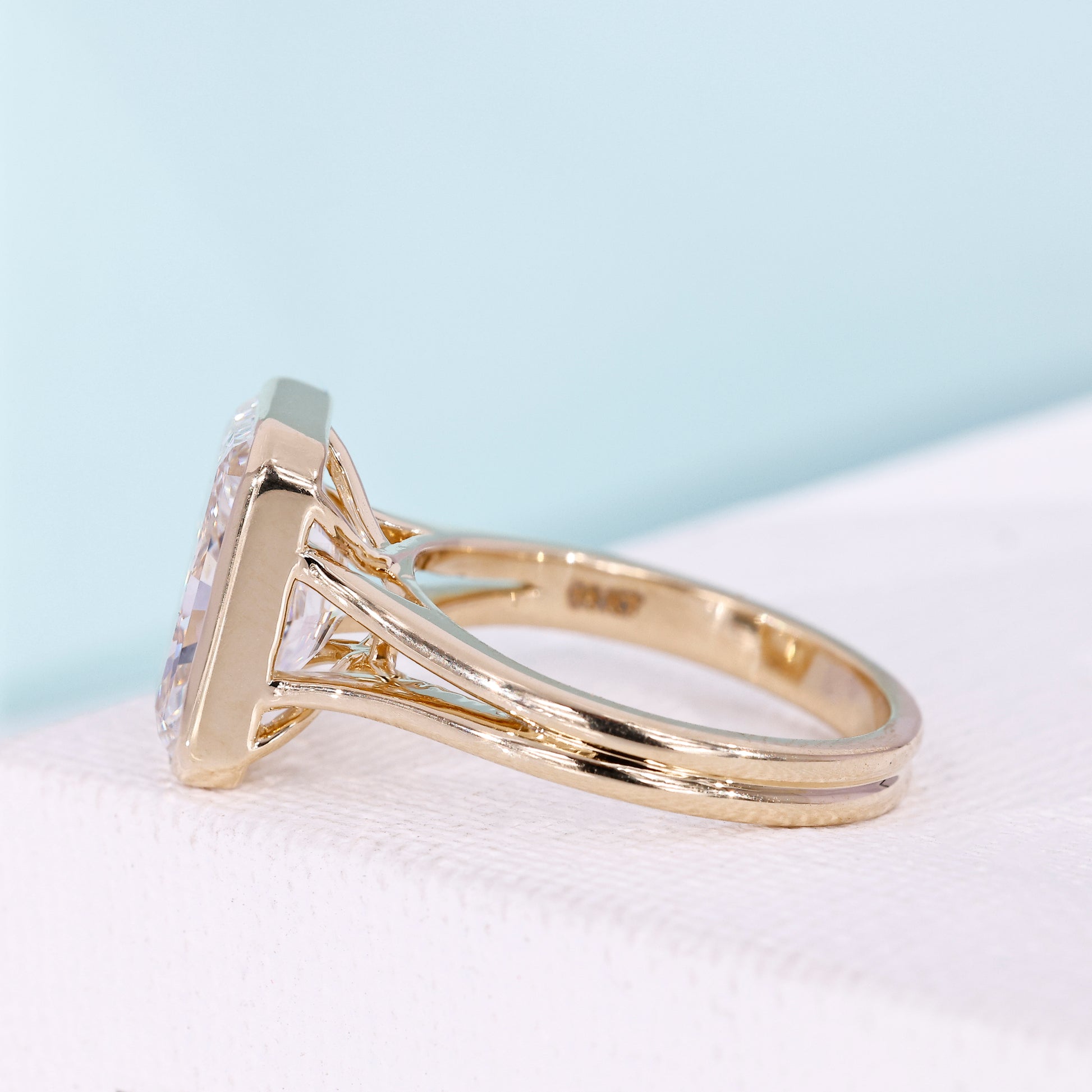 Radiant solitaire engagement ring in yellow gold