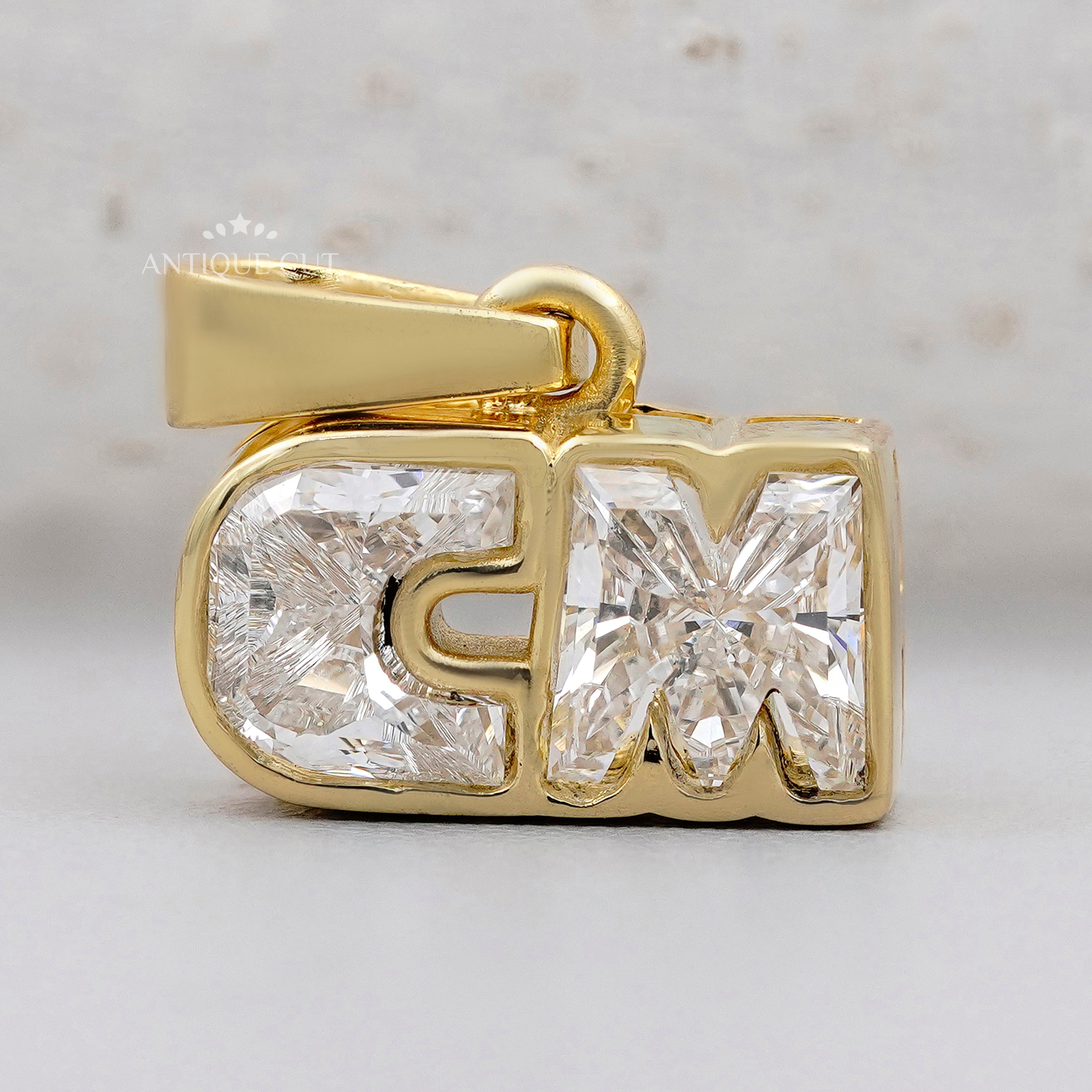 CM diamond alphabet letter pendant in yellow gold