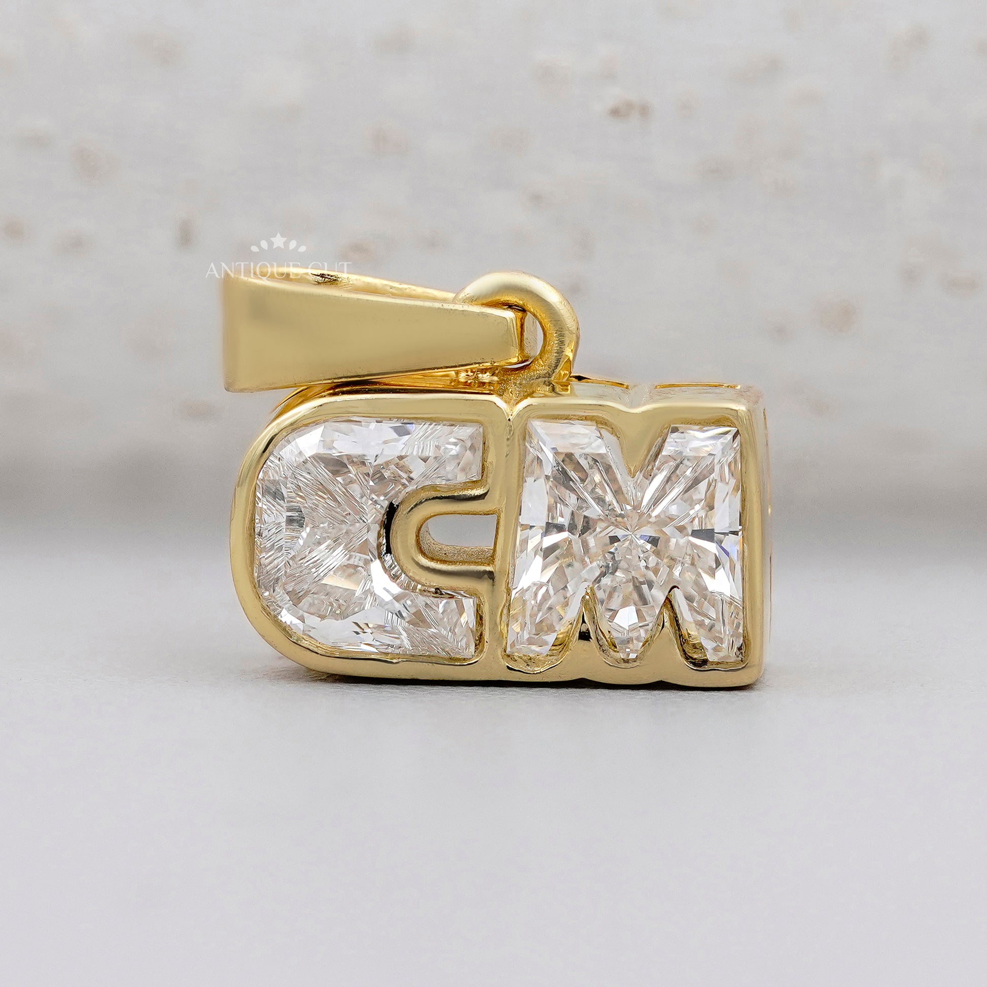CM diamond alphabet letter pendant in yellow gold