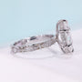Marquise engagement ring with round cut side stones
