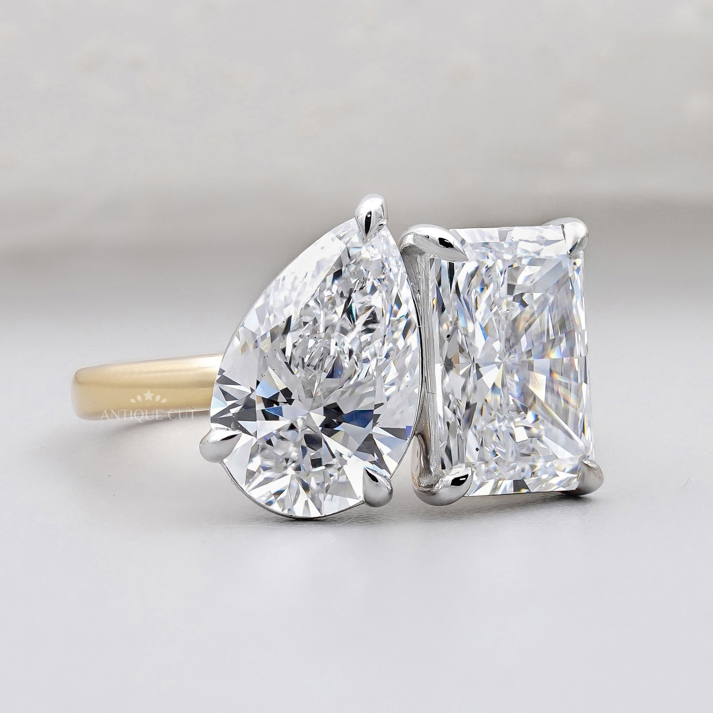 Radiant and pear diamond Toi Et Moi ring yellow gold