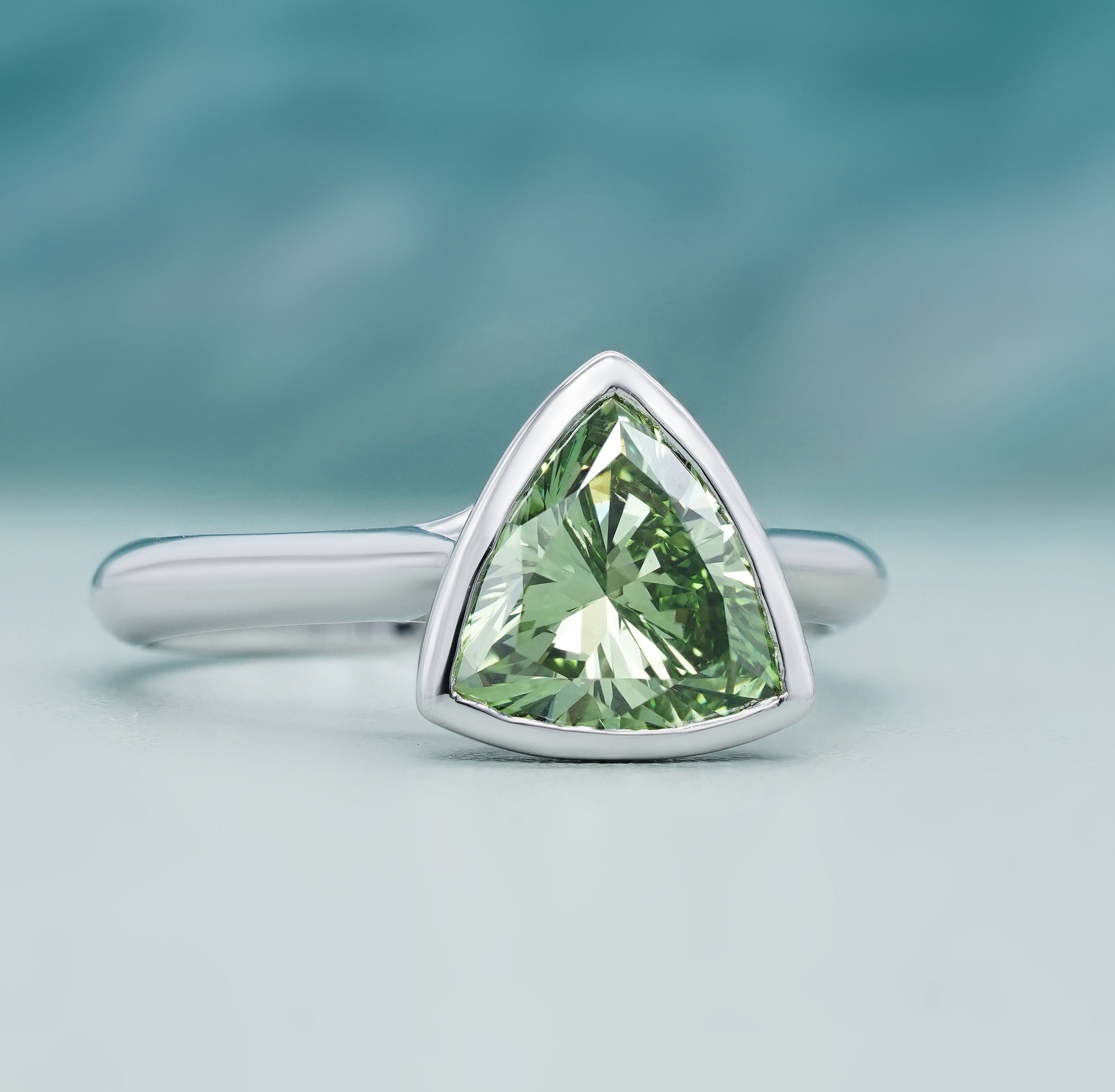 Lab grown trillion cut diamond ring green stone white gold