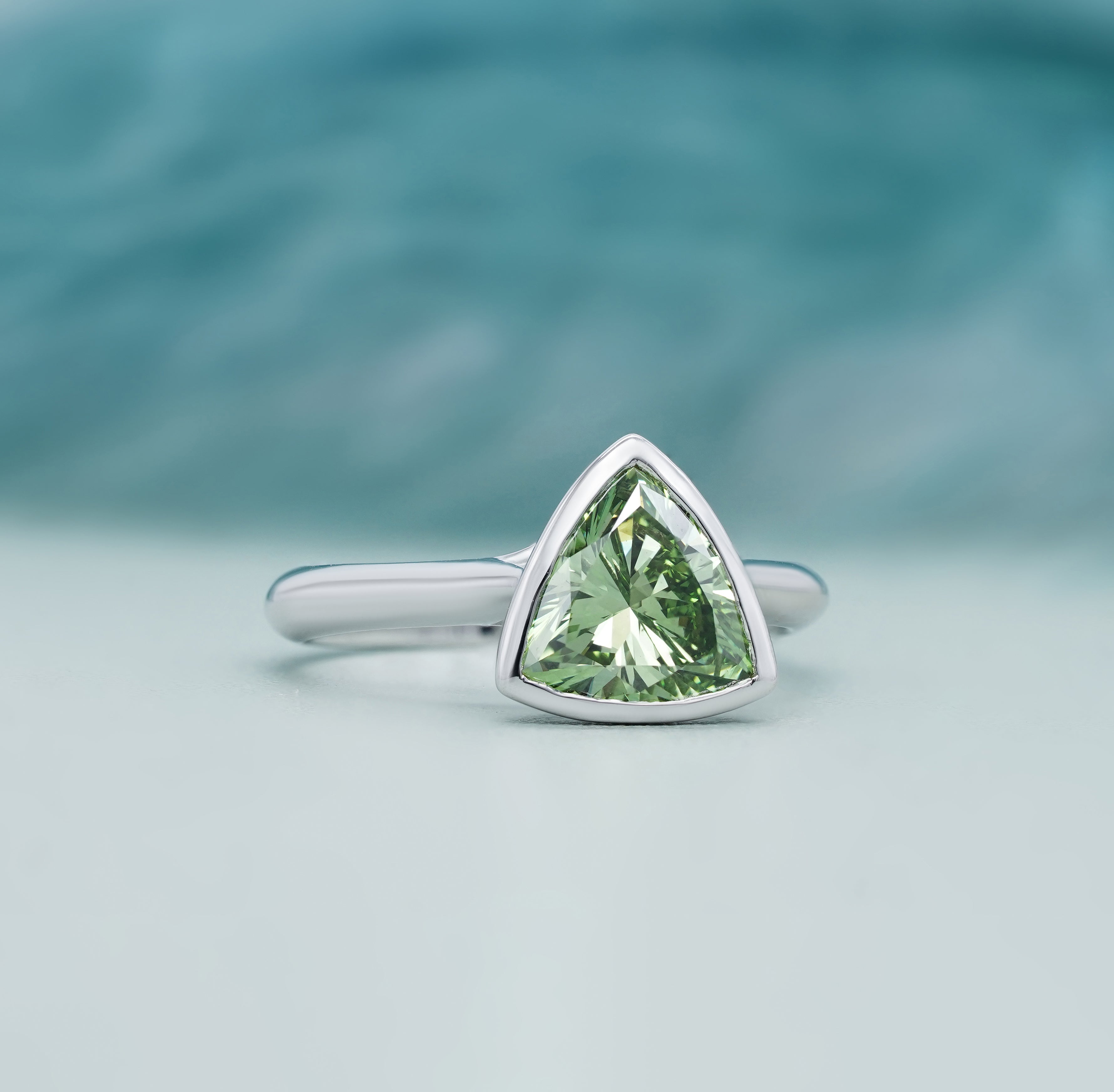 Lab grown trillion cut diamond ring green stone white gold