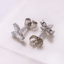 Butterfly shaped white gold earrings with diamond accents