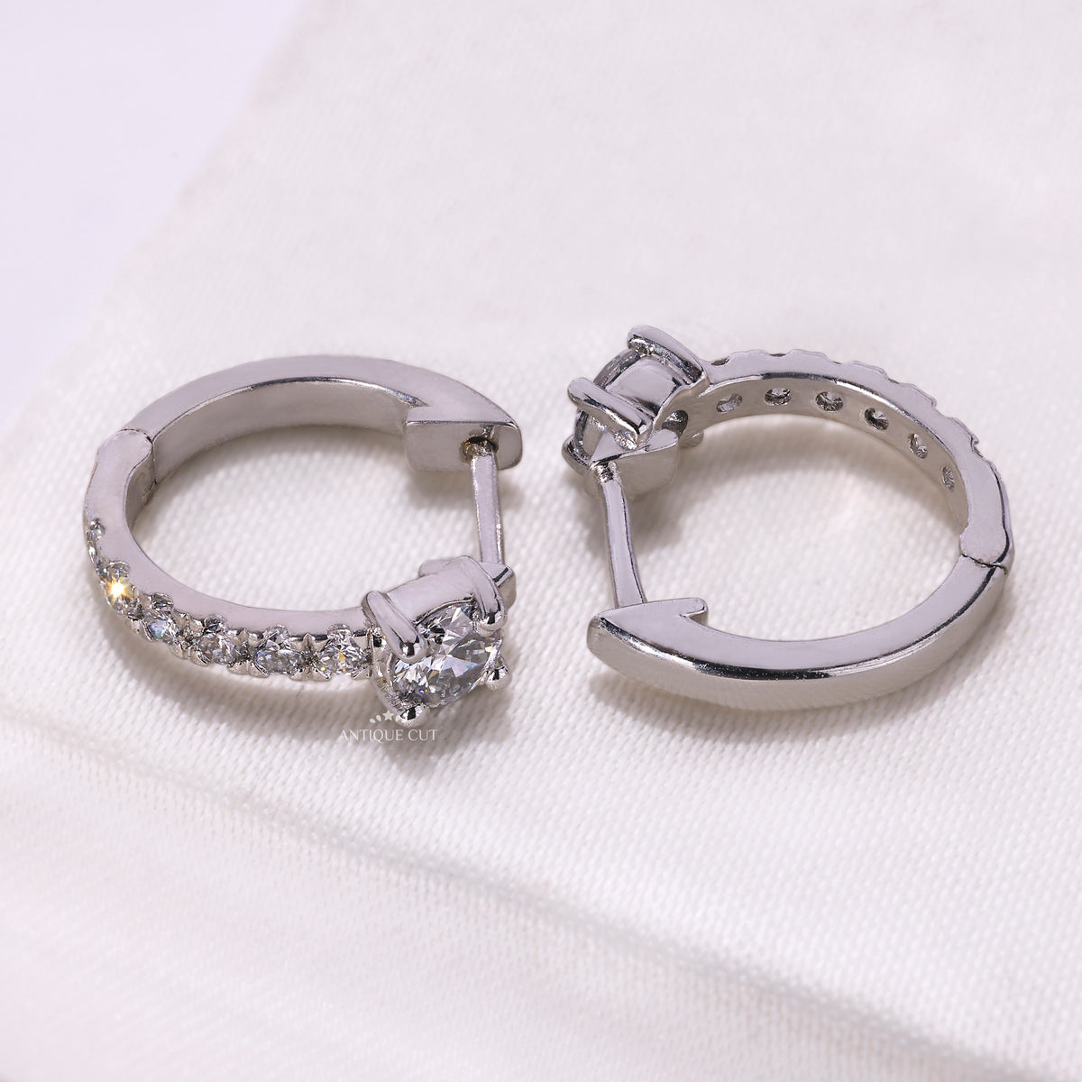 Round cut diamond hoop earrings with secure closure