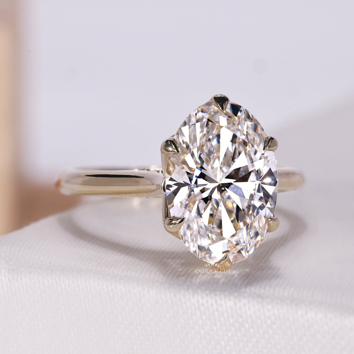 Vintage-style oval diamond ring with cathedral setting