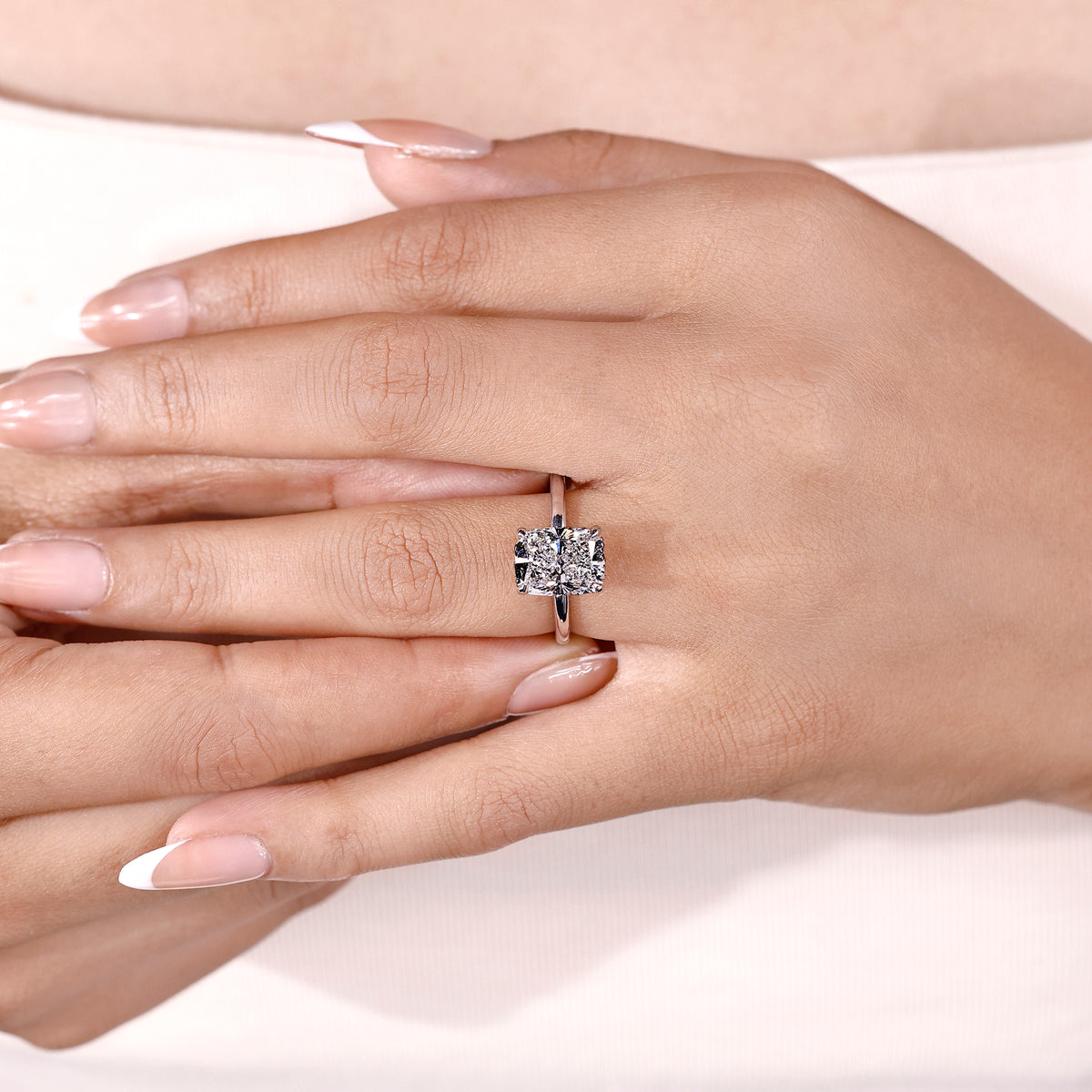 IGI certified cushion cut solitaire engagement ring with hidden halo
