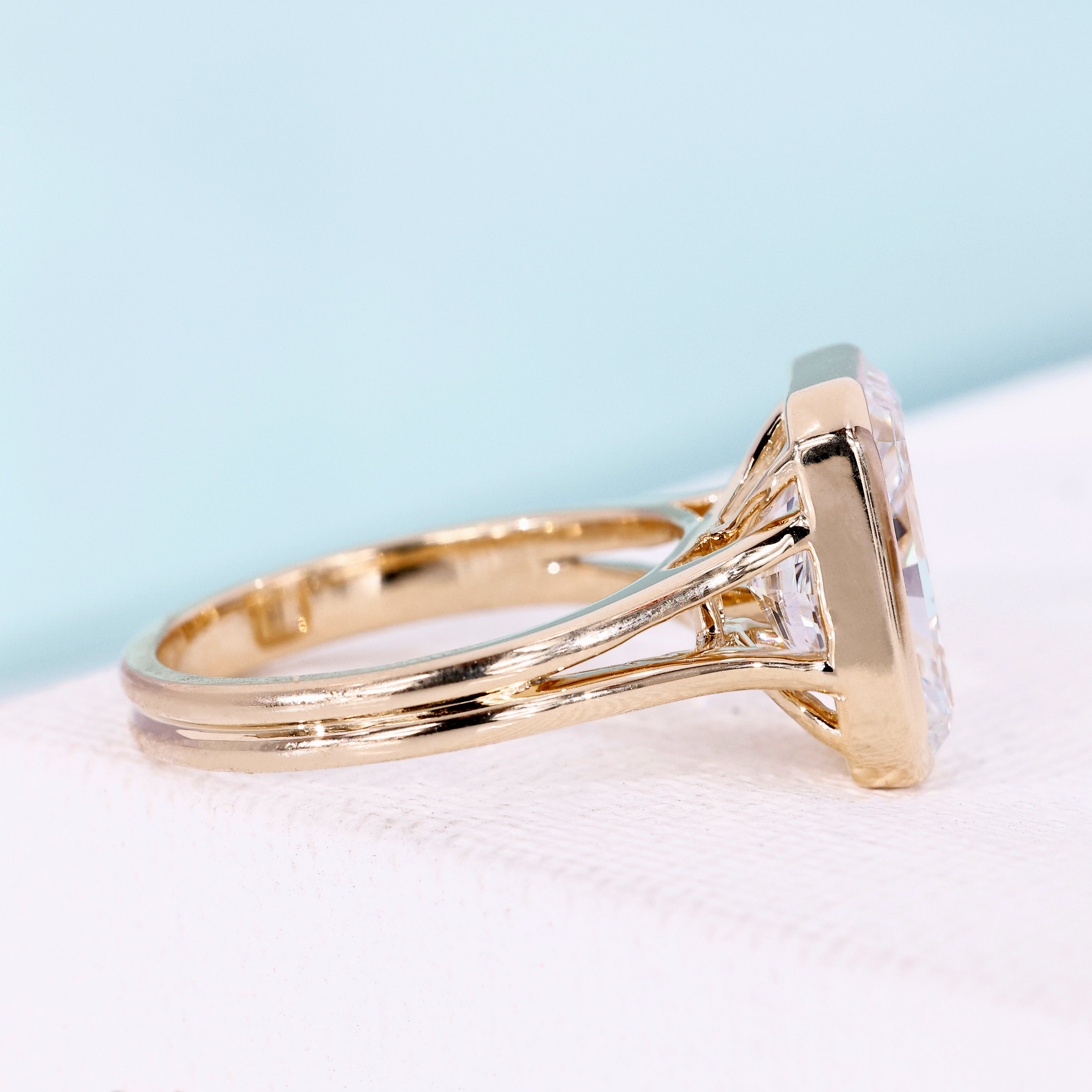 Yellow gold engagement ring with radiant cut diamond