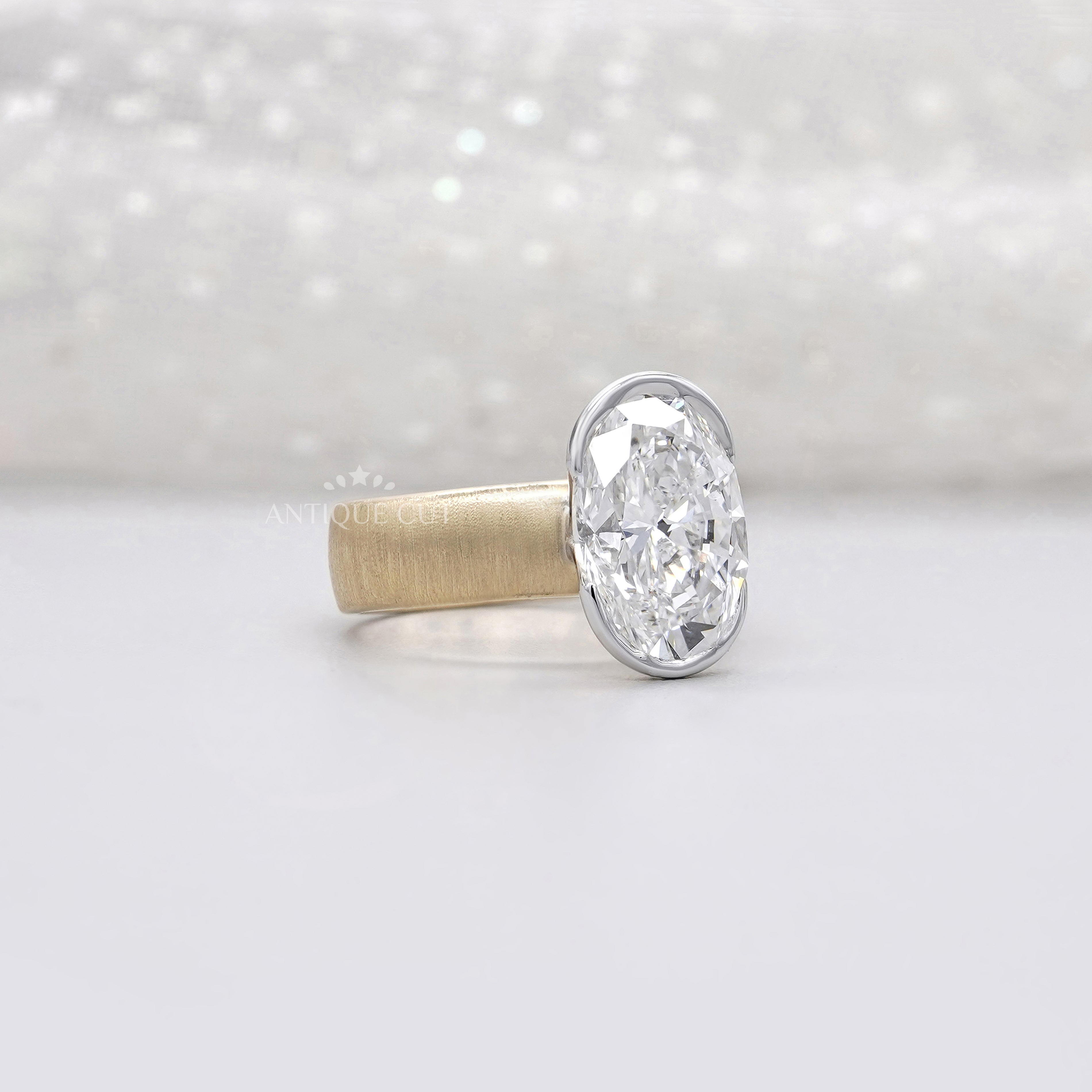 Oval solitaire diamond engagement ring with paper matte finish