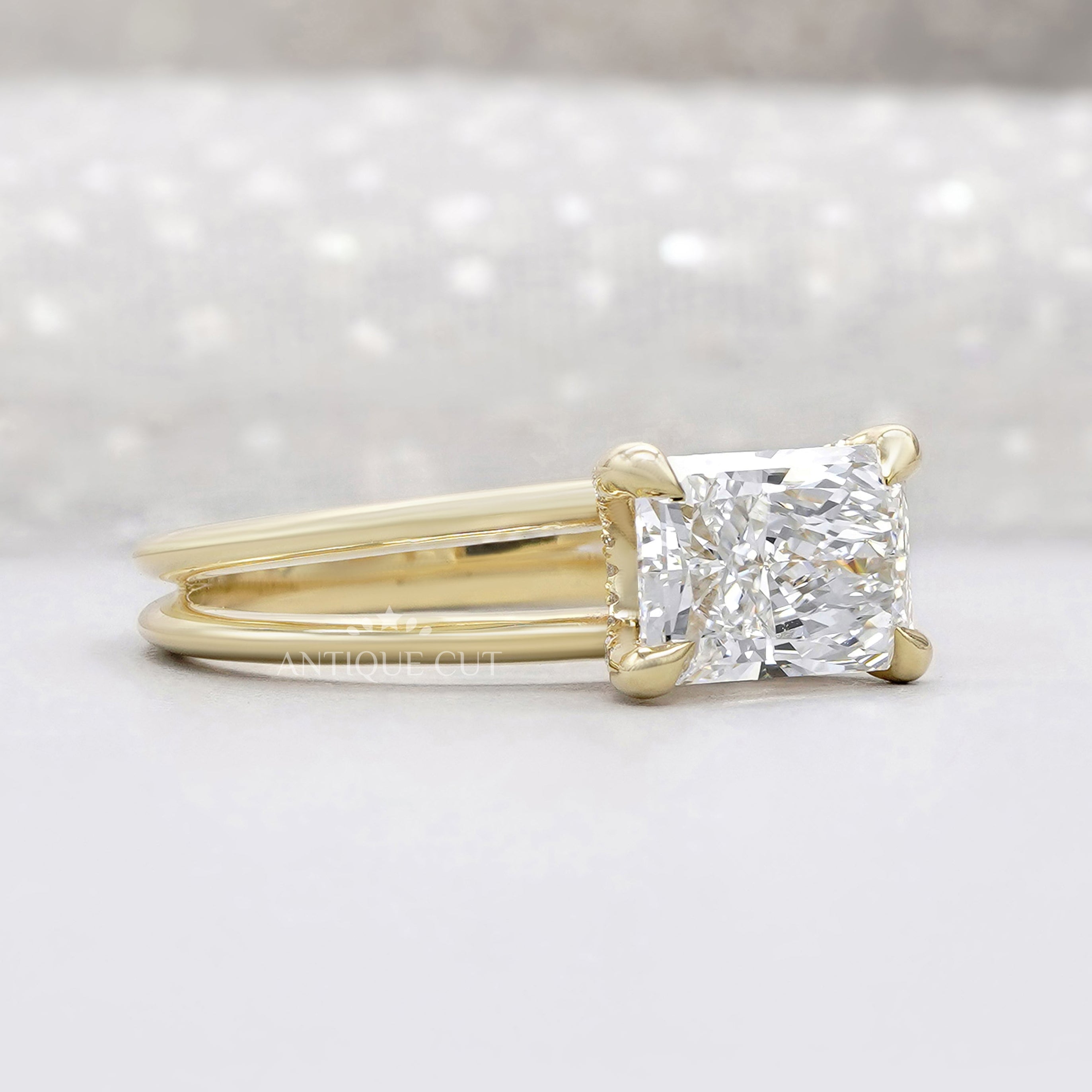 Yellow gold radiant diamond ring with east west setting
