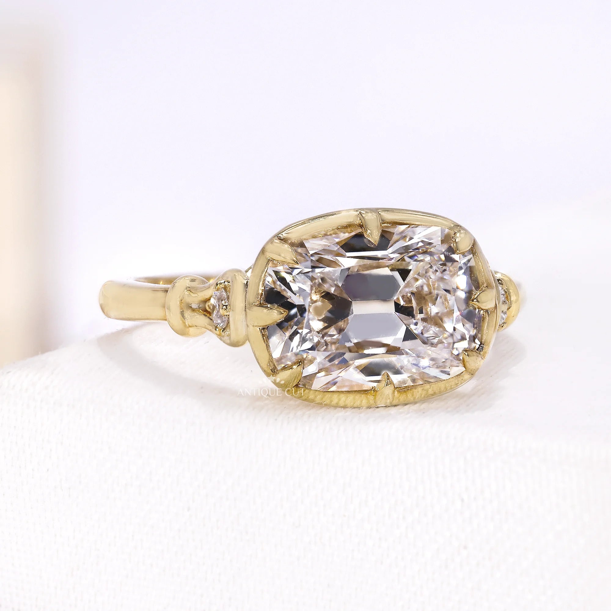 Side view of yellow gold ring showing raised vintage basket