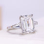 Emerald cut engagement ring with tapered baguette side stones
