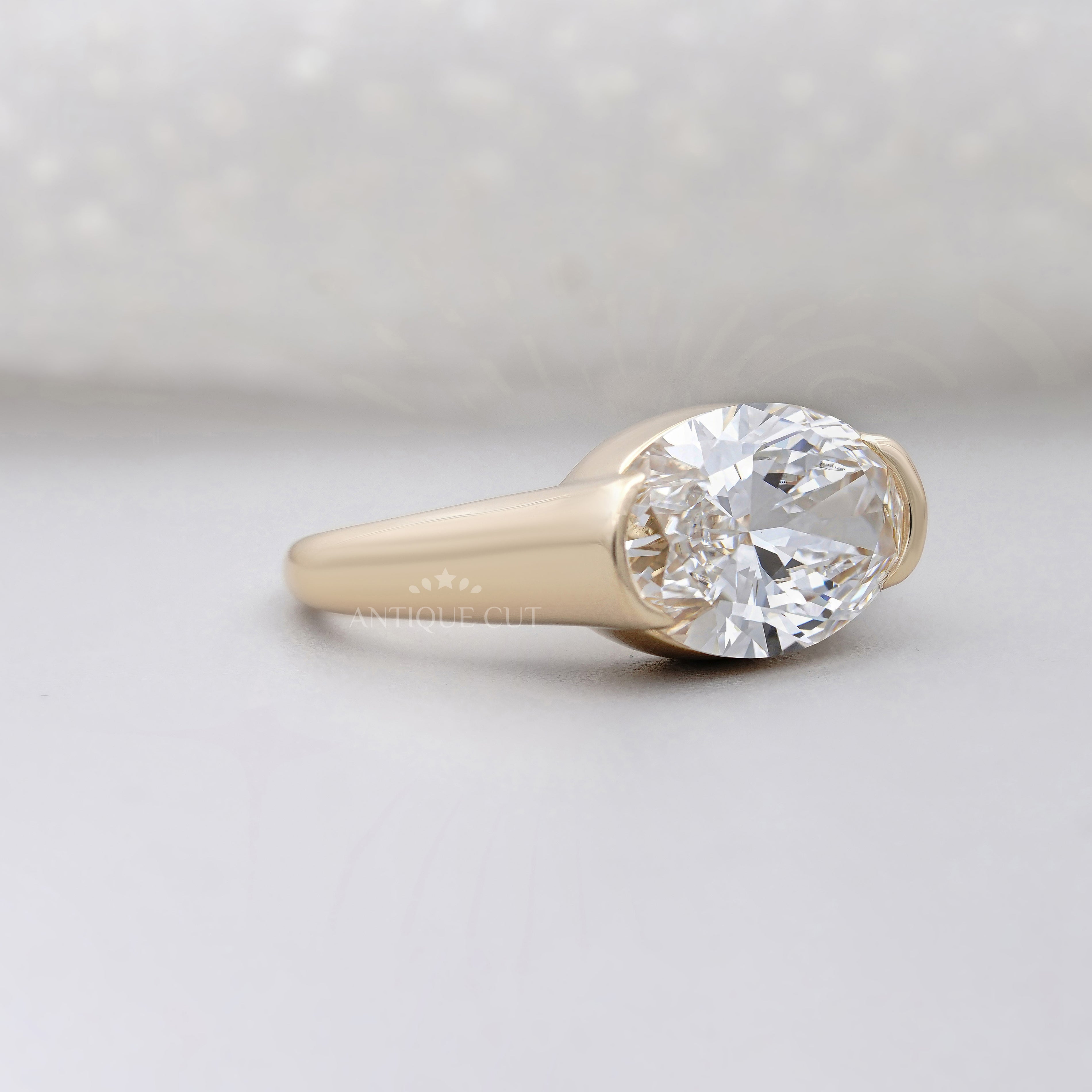 East West Oval Half Bezel Engagement Ring