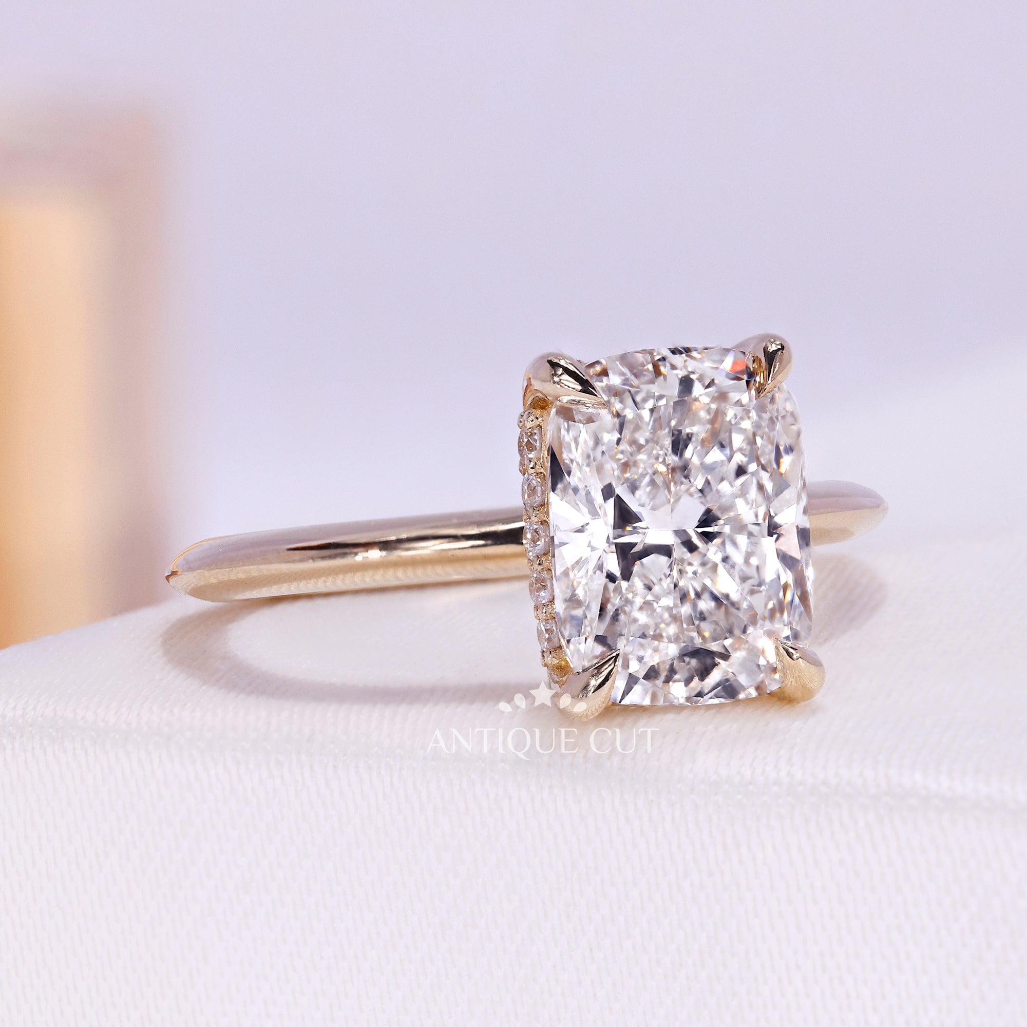 Cushion cut diamond ring with hidden halo