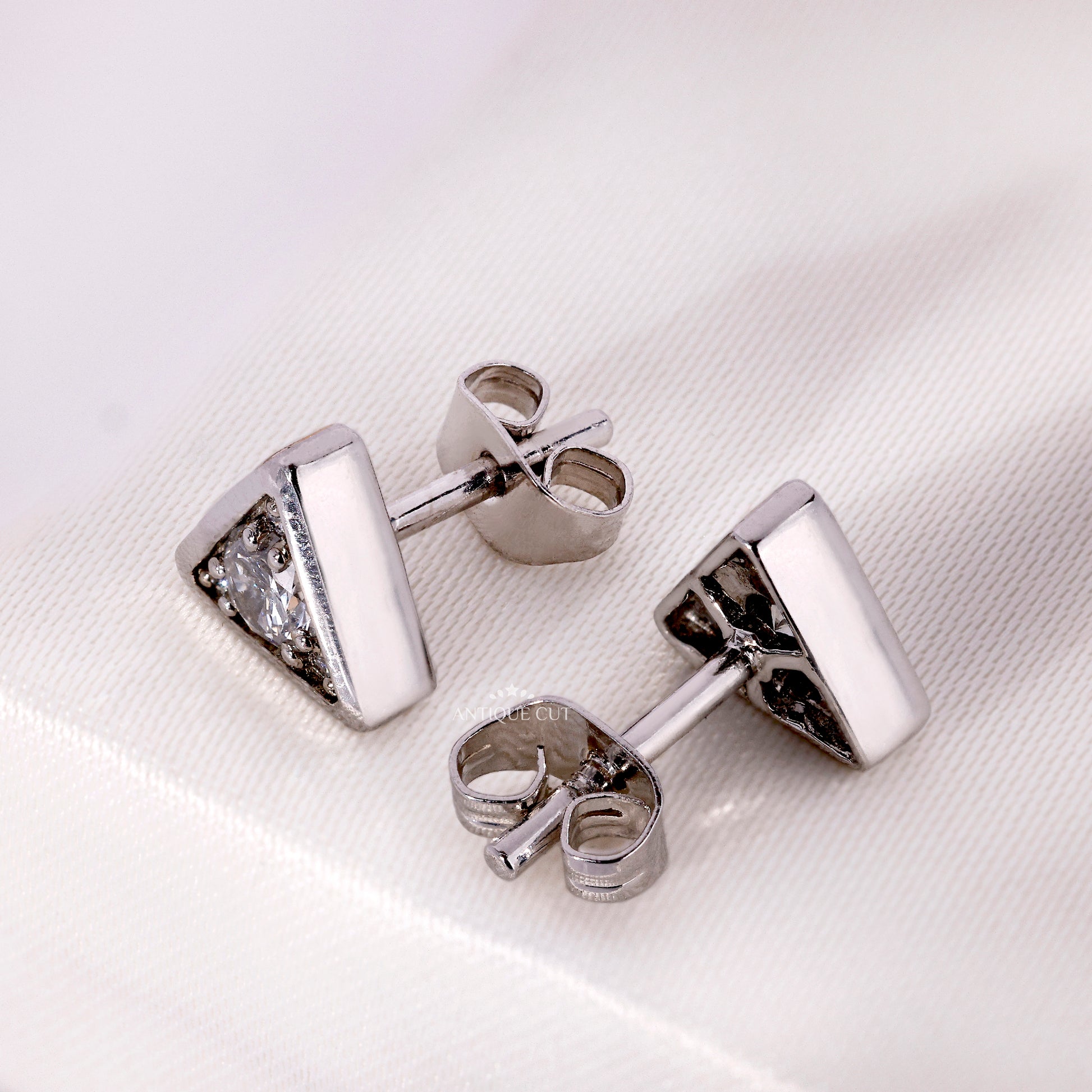 Triangle stud earrings with round lab grown diamonds
