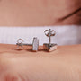 White gold triangle earrings with diamond accents