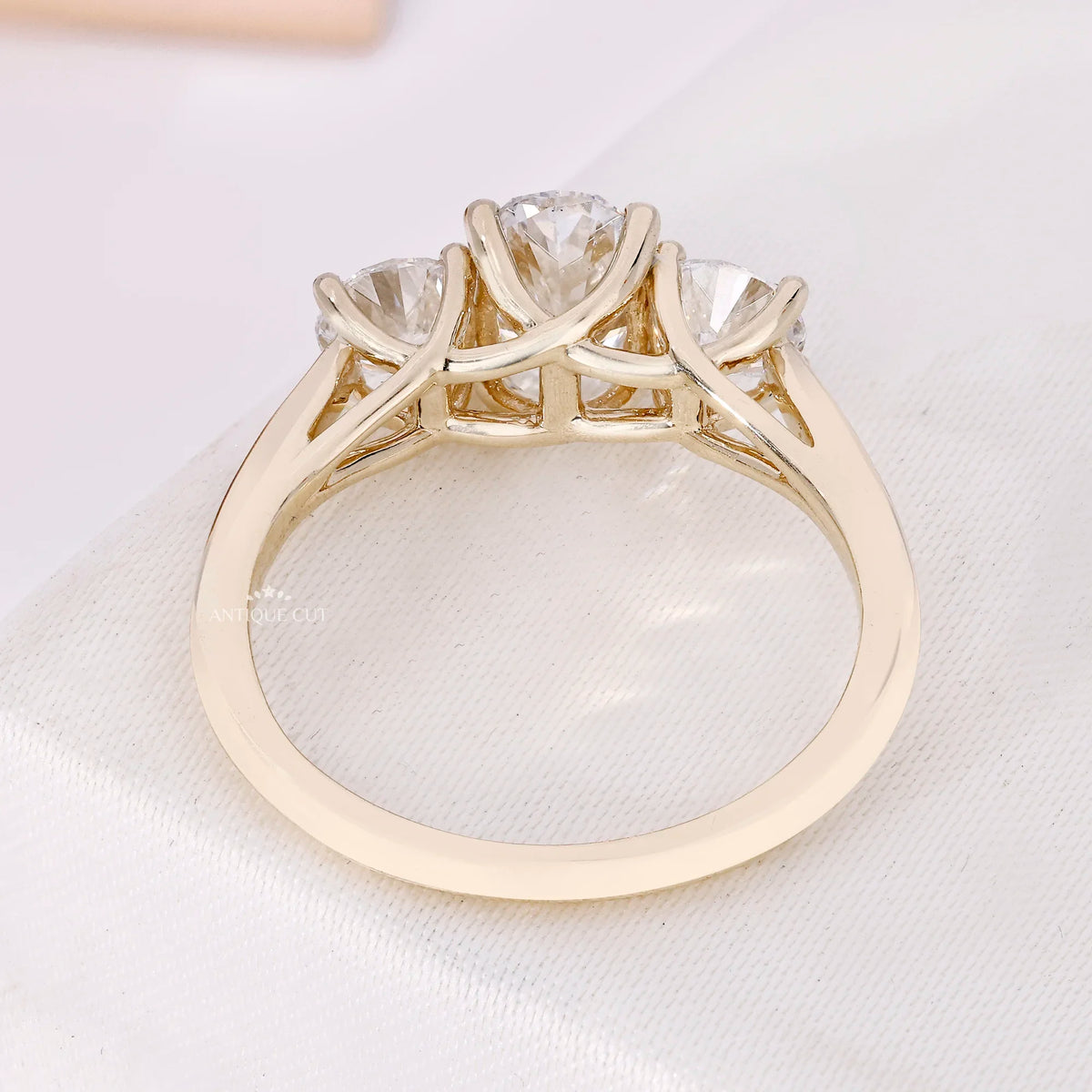 1.50 Carat Lab Grown Oval Cut Center Diamond & Two Round Side Stones With Trellis Gallery Setting